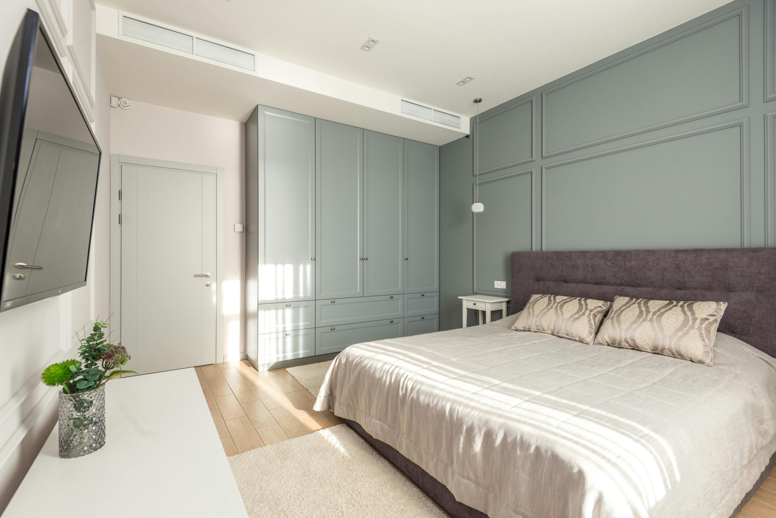 Bright modern bedroom with minimalistic design and stylish furniture.