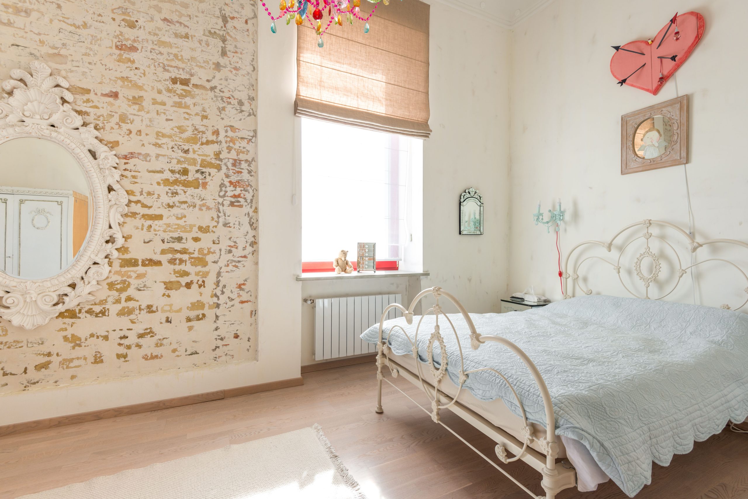 Charming bedroom featuring vintage-style furniture, rustic decor, and a bright, cozy atmosphere.