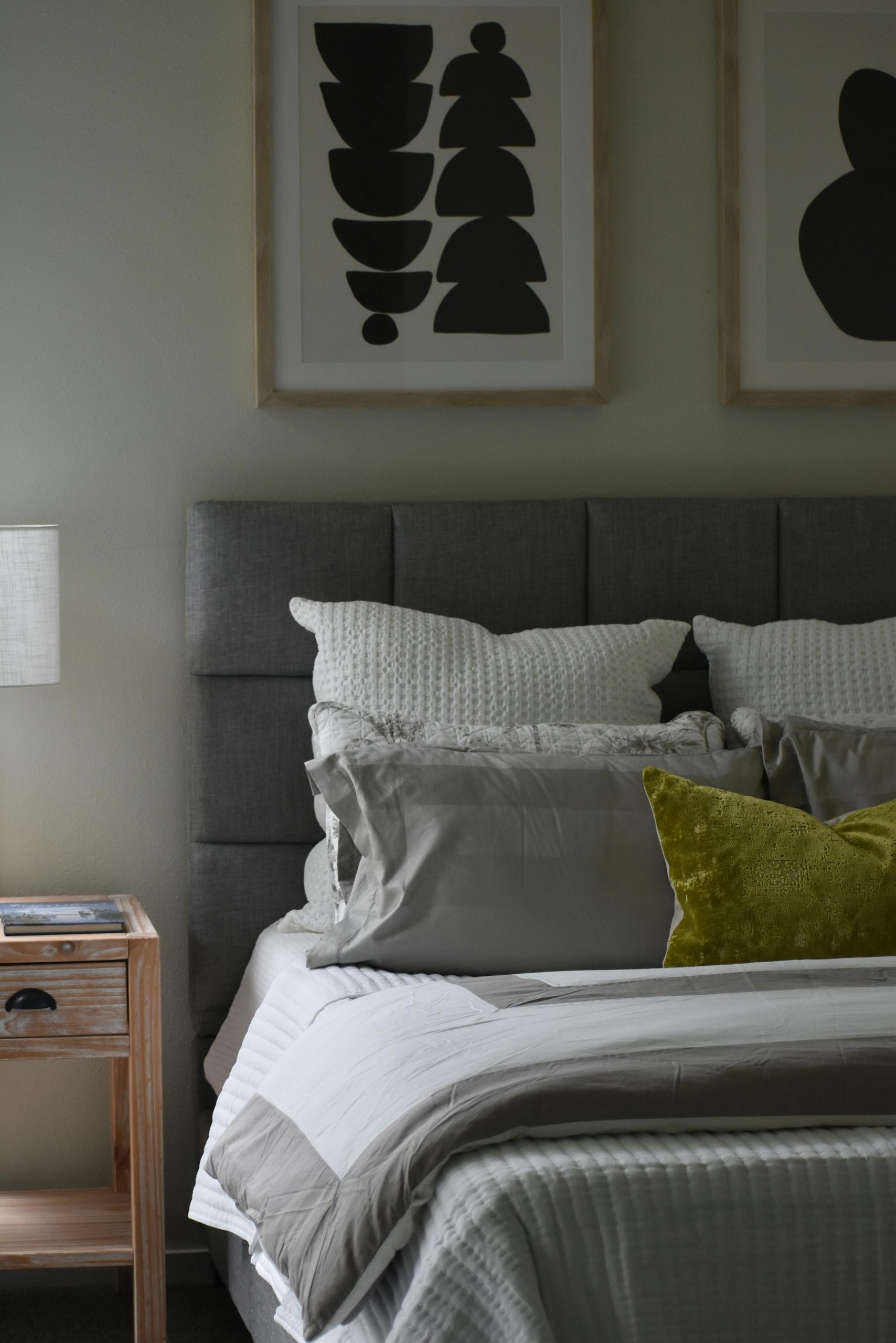 Cozy and inviting modern bedroom featuring elegant decor and abstract art.