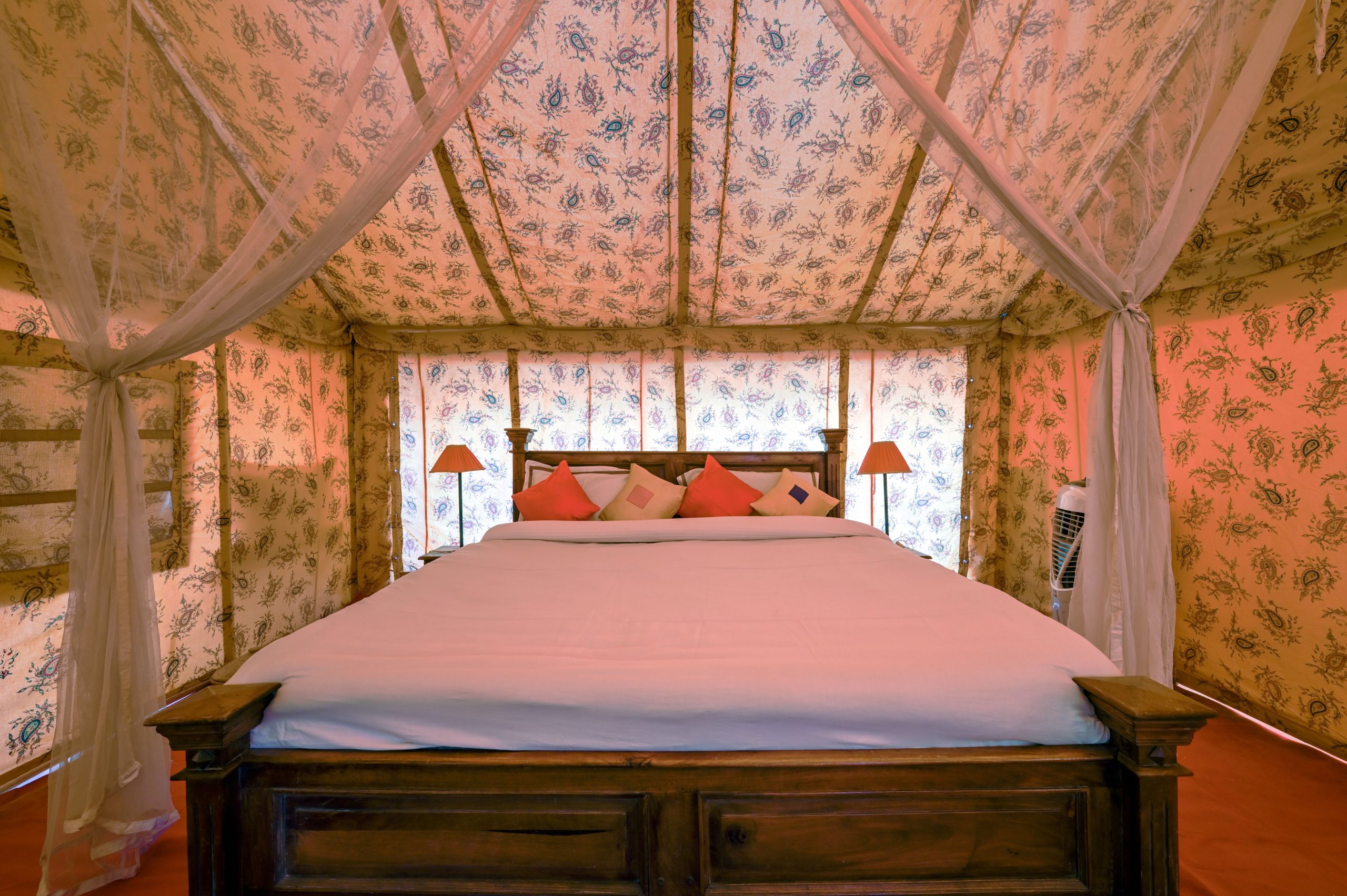 Elegant interior of a luxury tented bedroom in Jaisalmer, Rajasthan, India, featuring chic decor.
