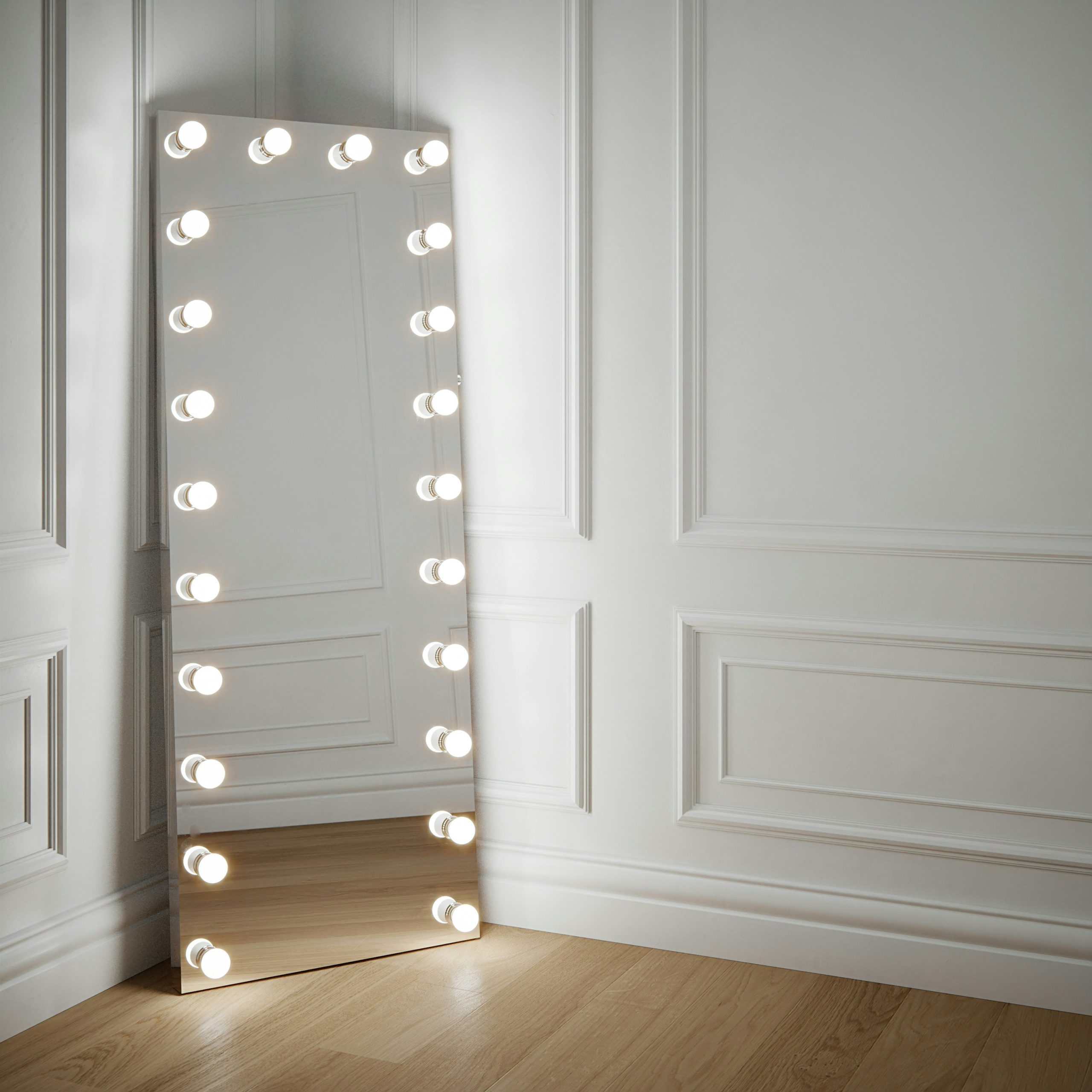 Full length Hollywood mirror with light bulbs Floor standing and leaning against a panel wall