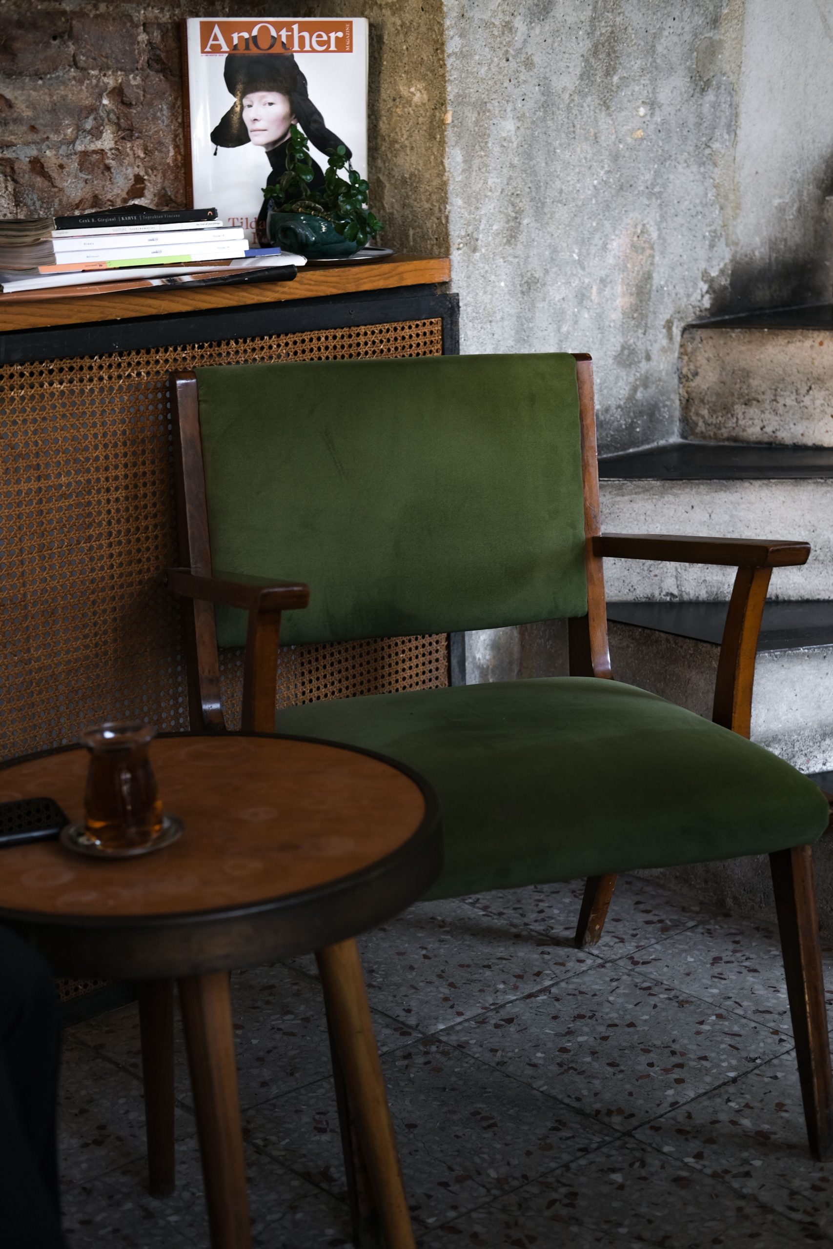 Inviting corner with a vintage armchair and table at an Istanbul café.