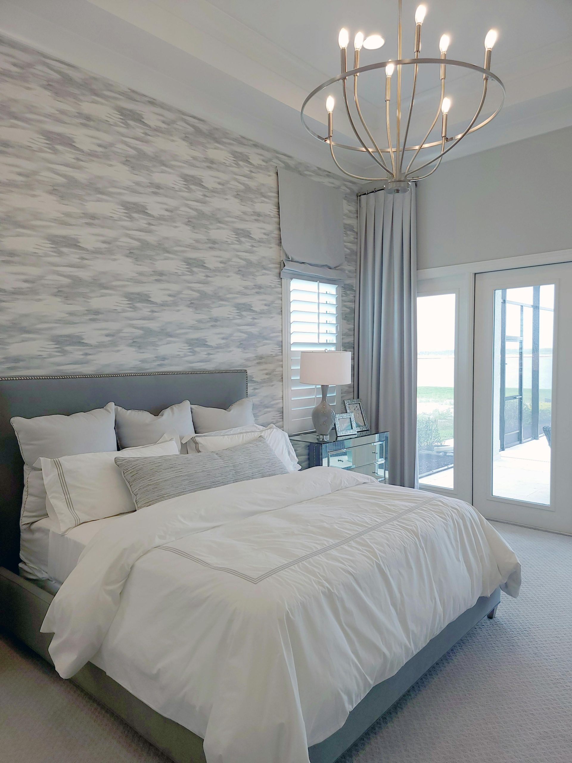 Modern bedroom with elegant decor, spacious layout, and natural light.