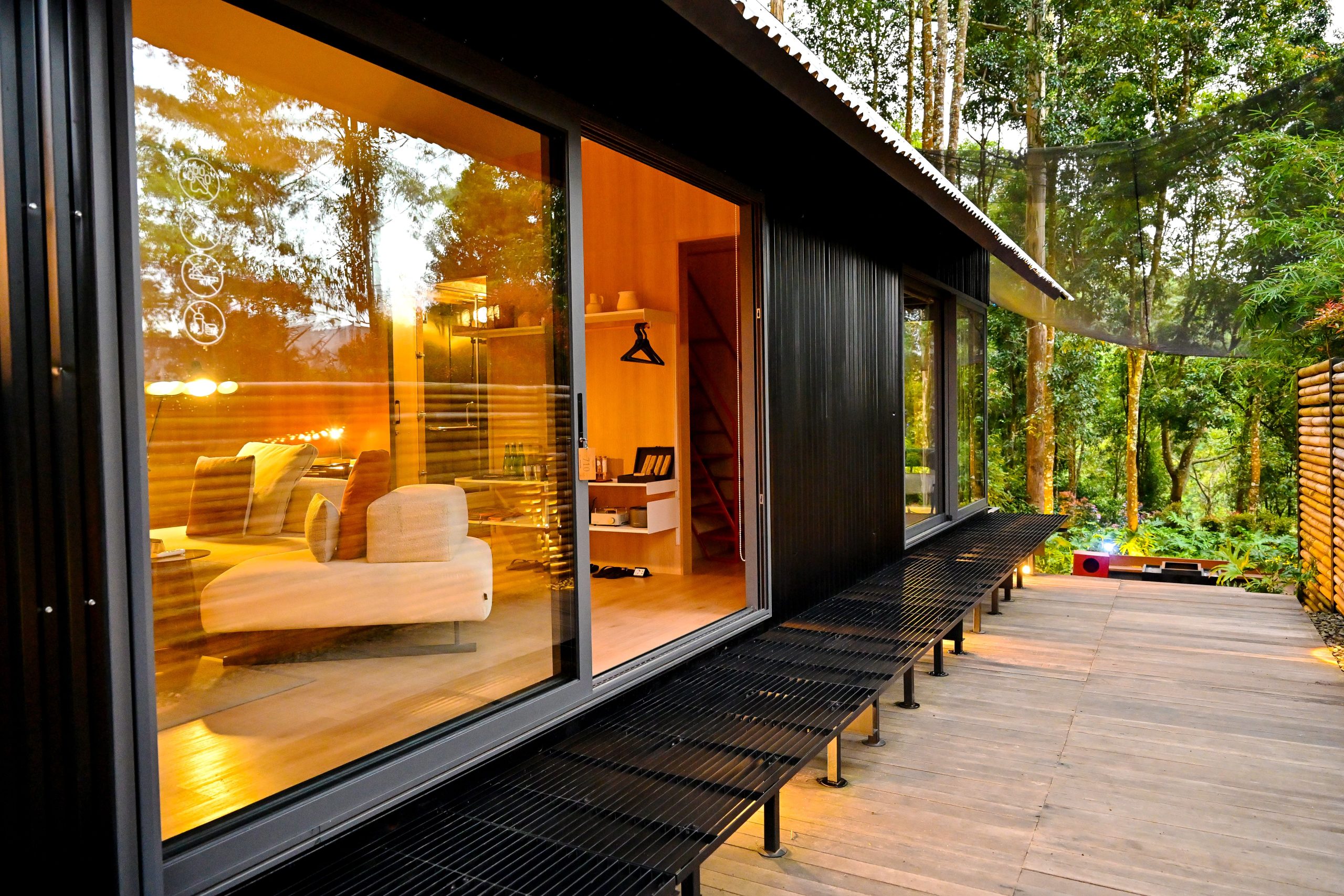 Modern cabin with warm interior and forest view in Java, Indonesia. Perfect for relaxation and nature retreats.