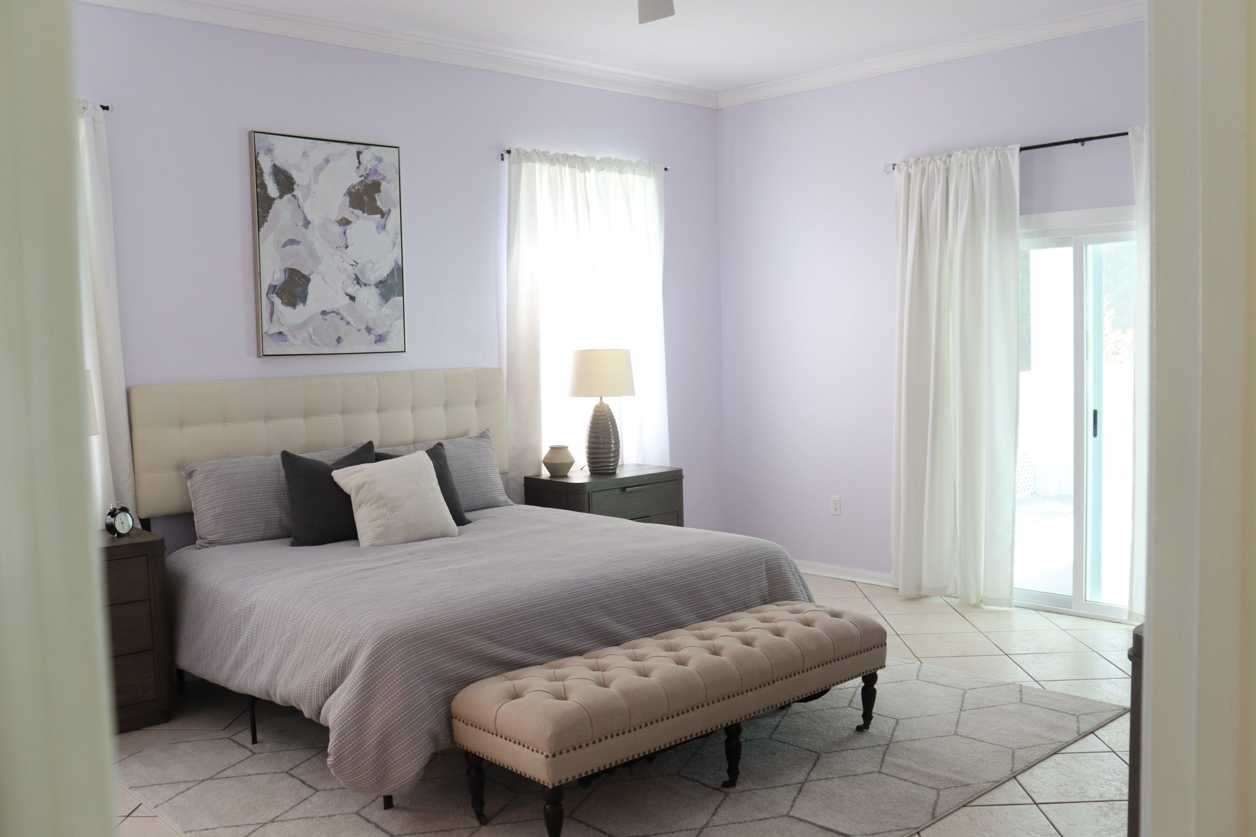 Serene and stylish bedroom interior with neutral tones and natural lighting.