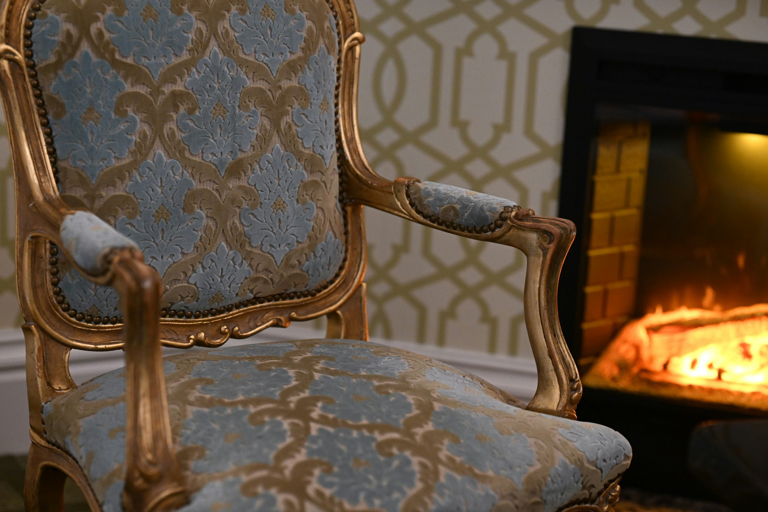 Victorian chair in front of a fireplace in Napa County