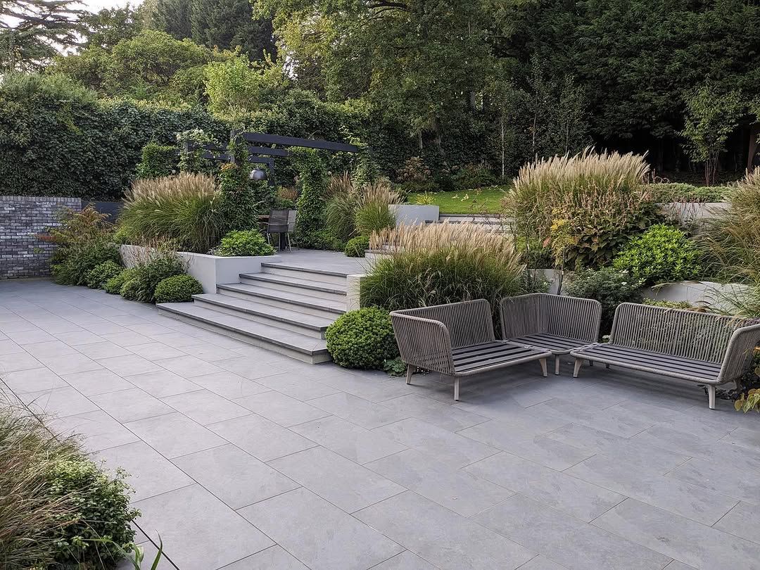 21 Sloped Backyard Ideas for 2026 That Use Terracing Instead of Fighting the Grade