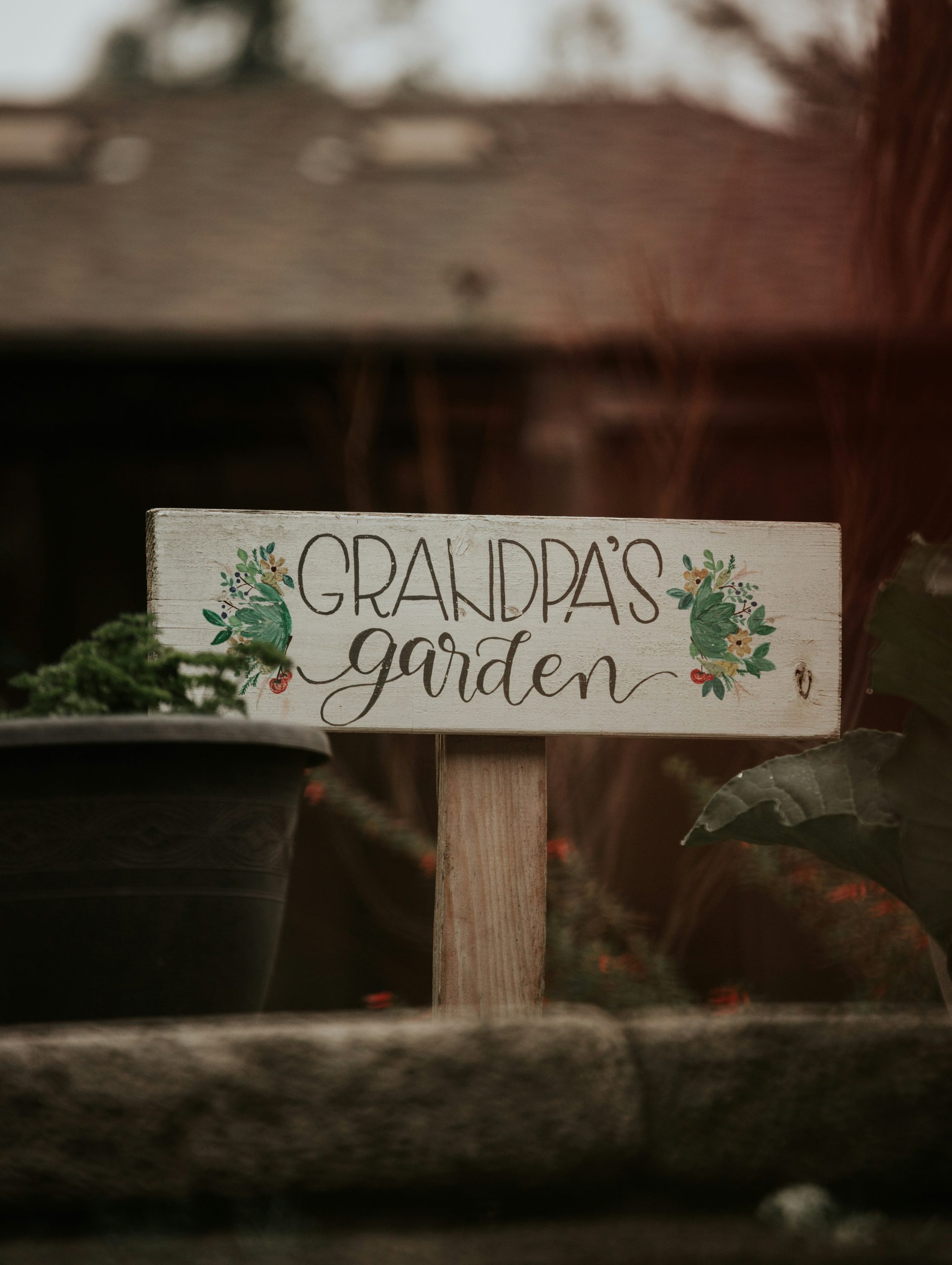 a wooden sign that says grandpa's garden