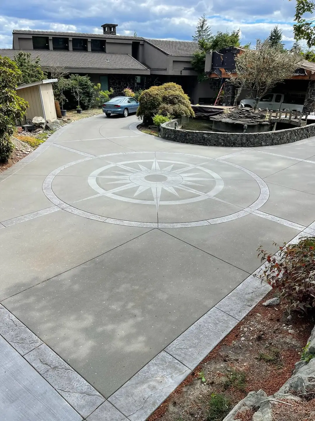 Ashlar Slate Stamped Concrete Driveway with Integrated Steps and Lighting in Tacoma, WA | RC Concrete Projects