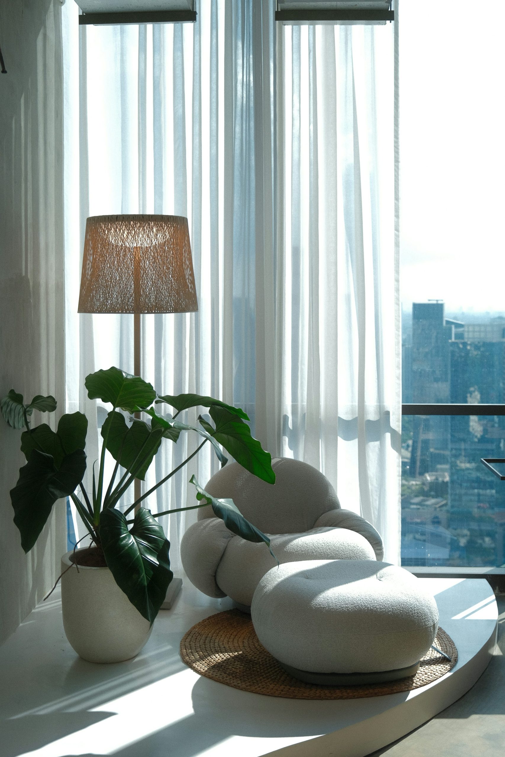 Cozy corner with a lamp, plant, and chair. photo – Free Blue Image on Unsplash