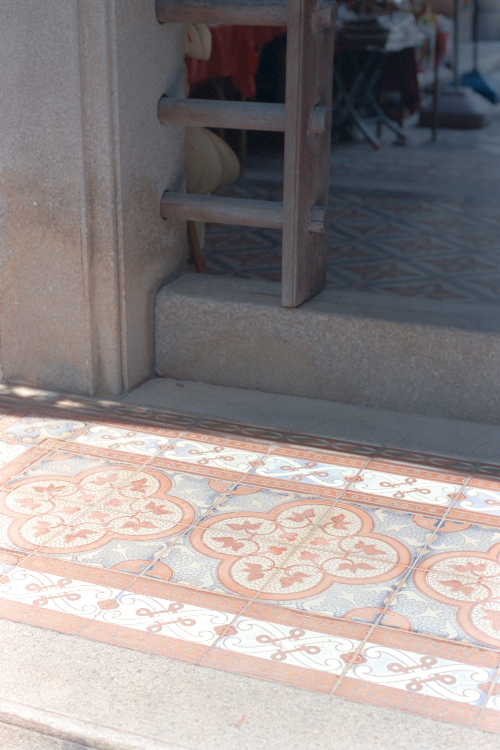 Decorative floor tiles with floral pattern.