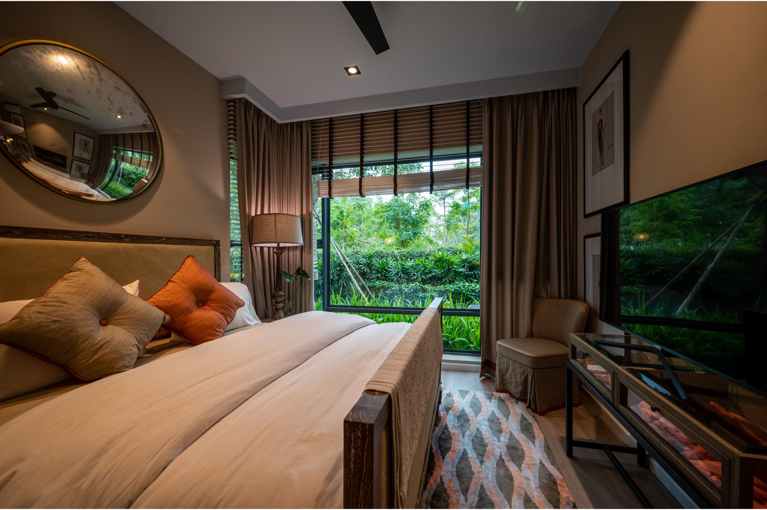Elegant bedroom with modern decor and lush garden view, perfect for home inspiration.