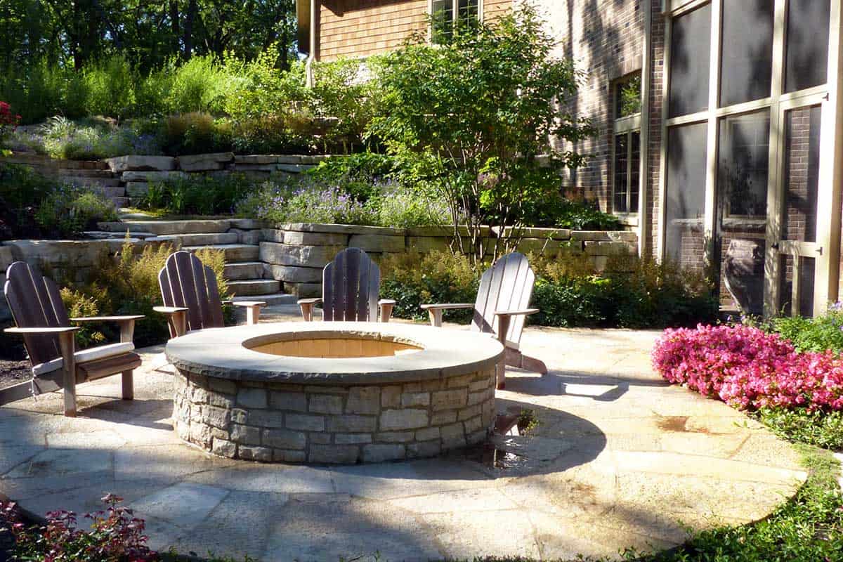 Raised Stone Fire Pit Surrounded by Flagstone - Van Zelst