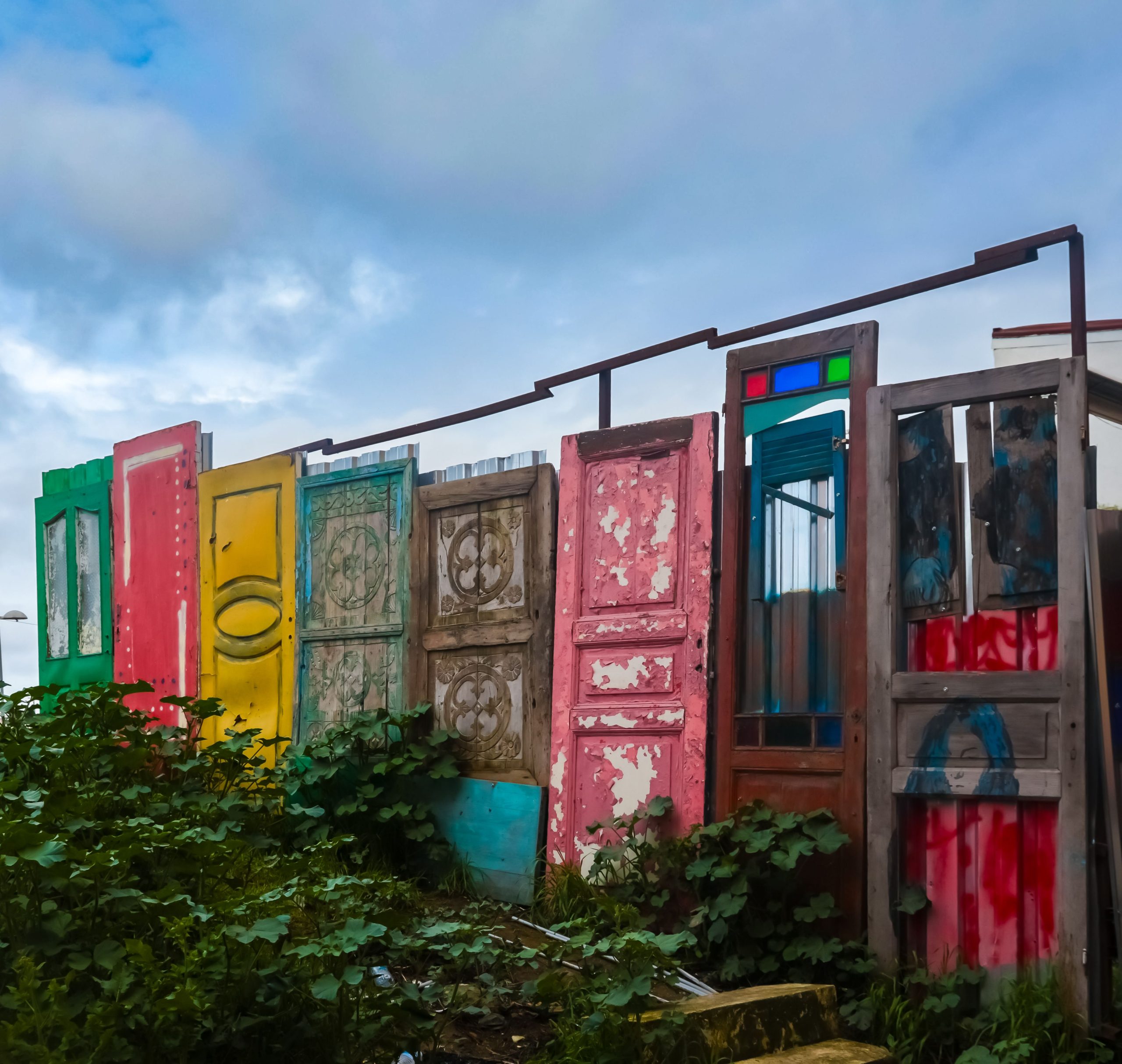 Vibrant and eclectic door art installation set outdoors in İstanbul, Türkiye.