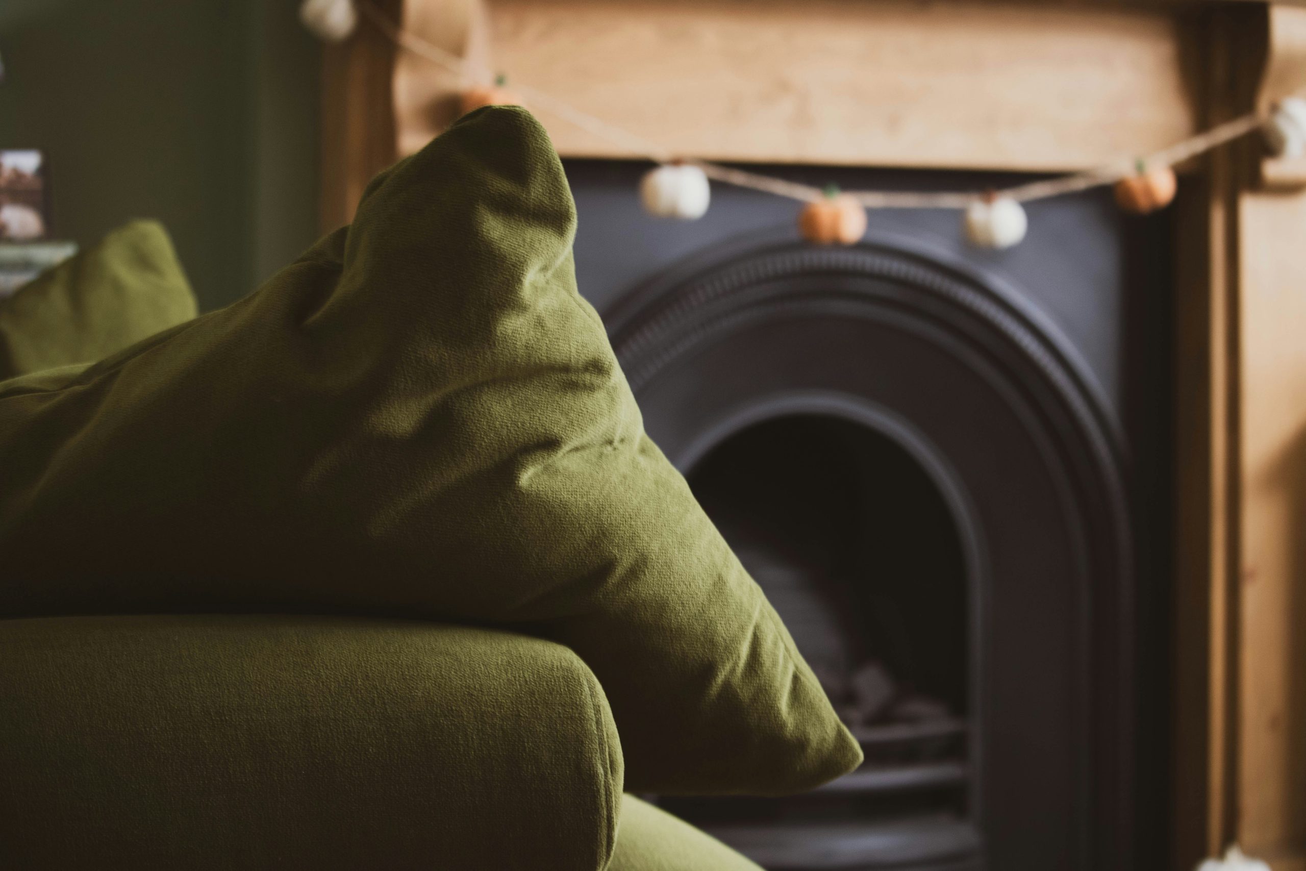 A living room with a couch and a fire place
