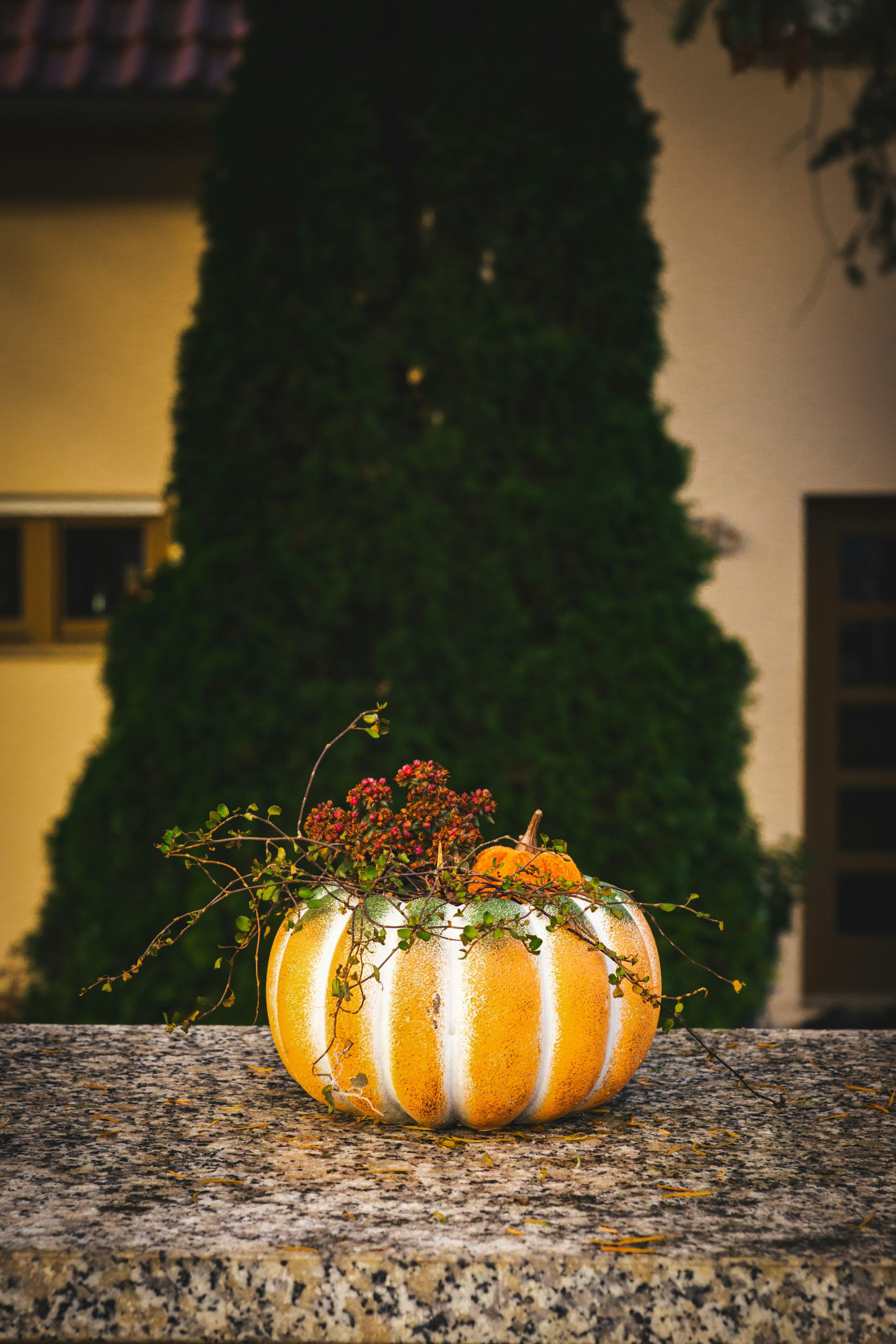 A pumpkin sitting on top of a stone table