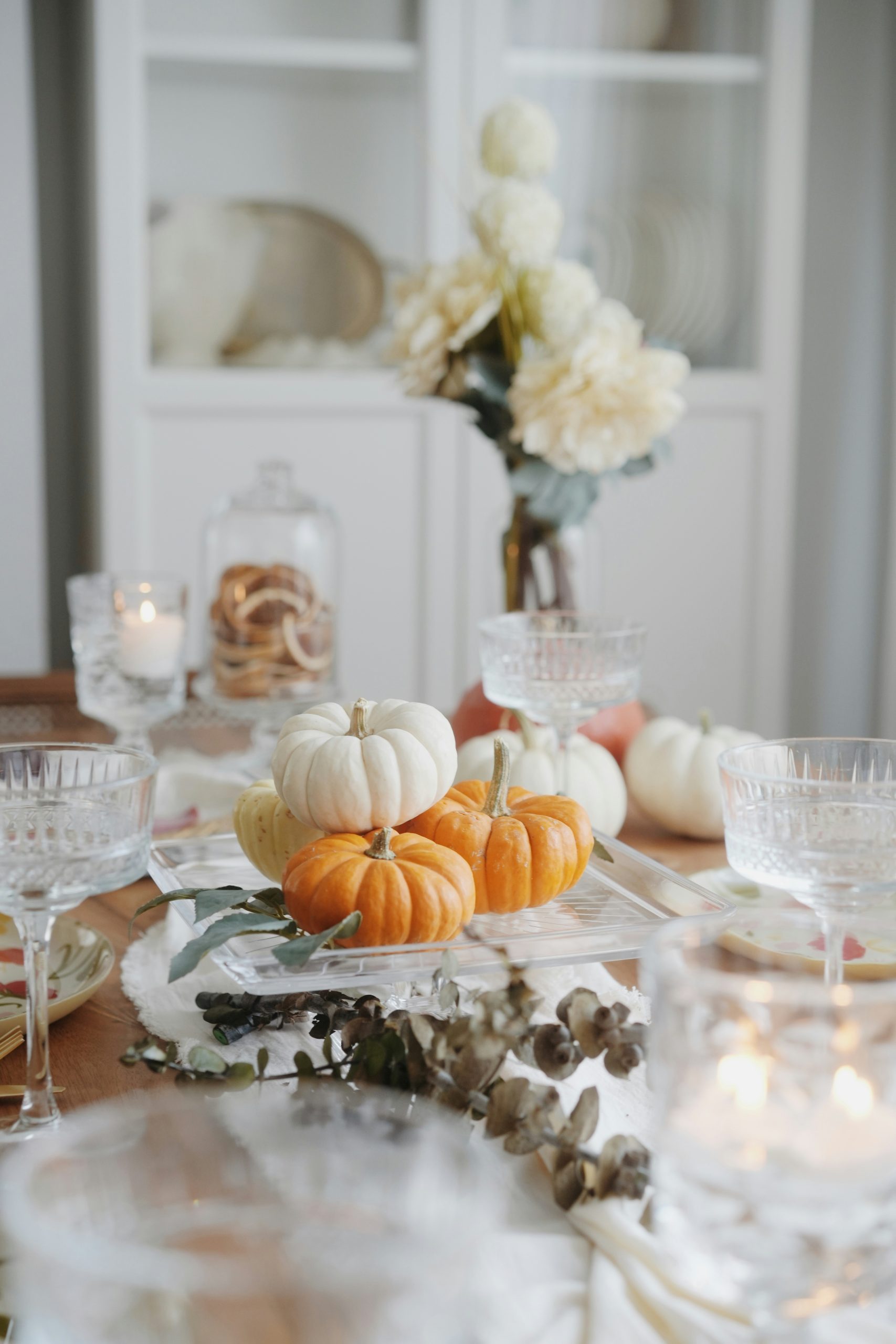A table with a bunch of pumpkins on it