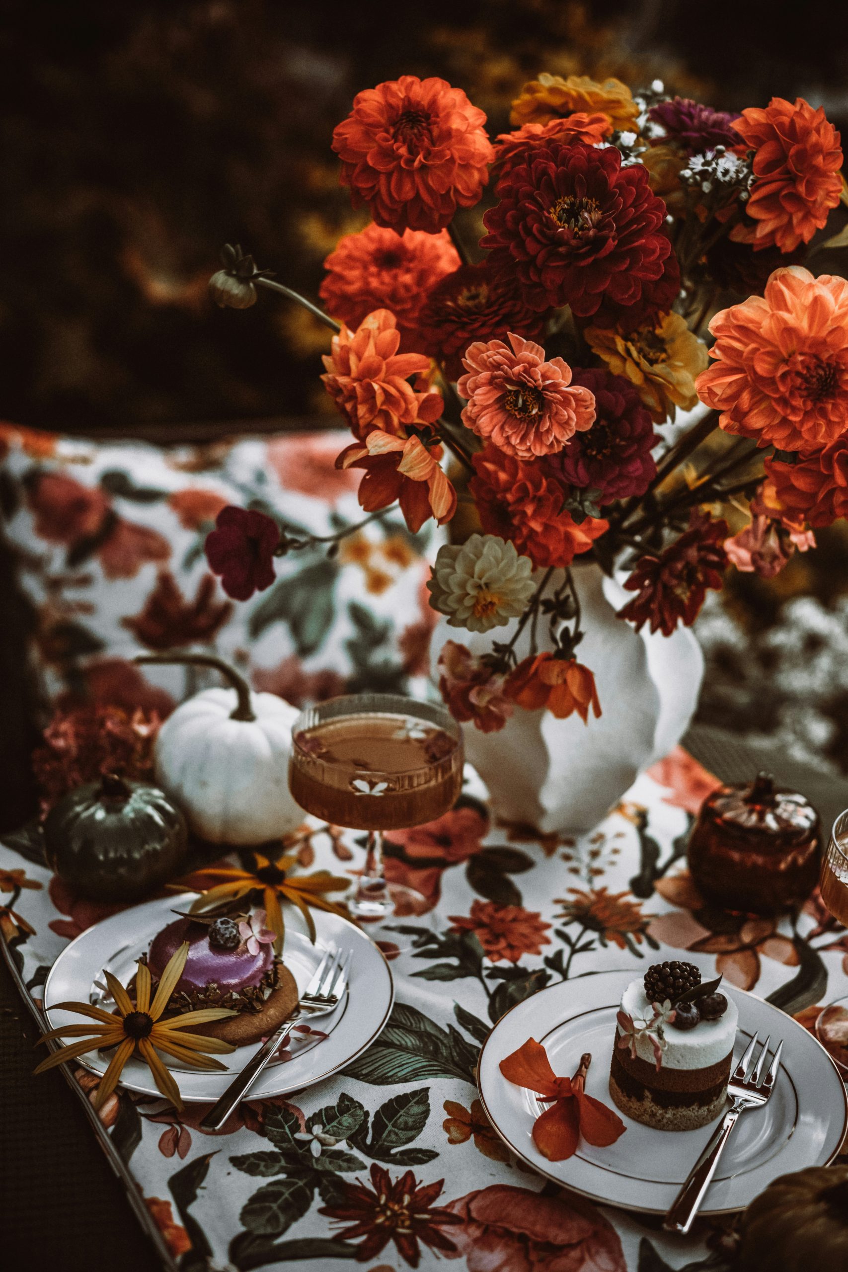 Autumnal table setting with desserts and flowers