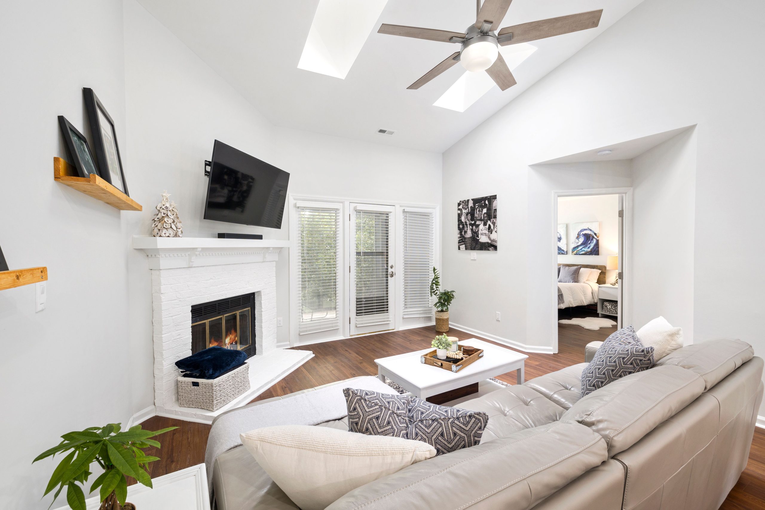 Bright and contemporary living room with a fireplace and stylish decor.