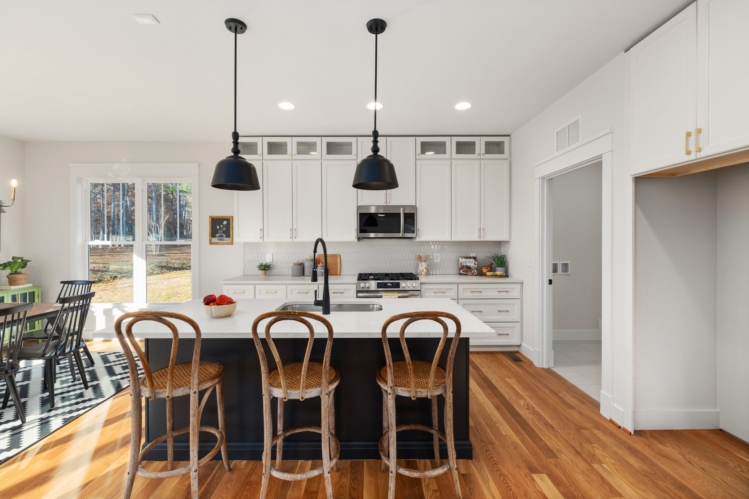 Bright, contemporary kitchen featuring wood accents and farmhouse aesthetic.