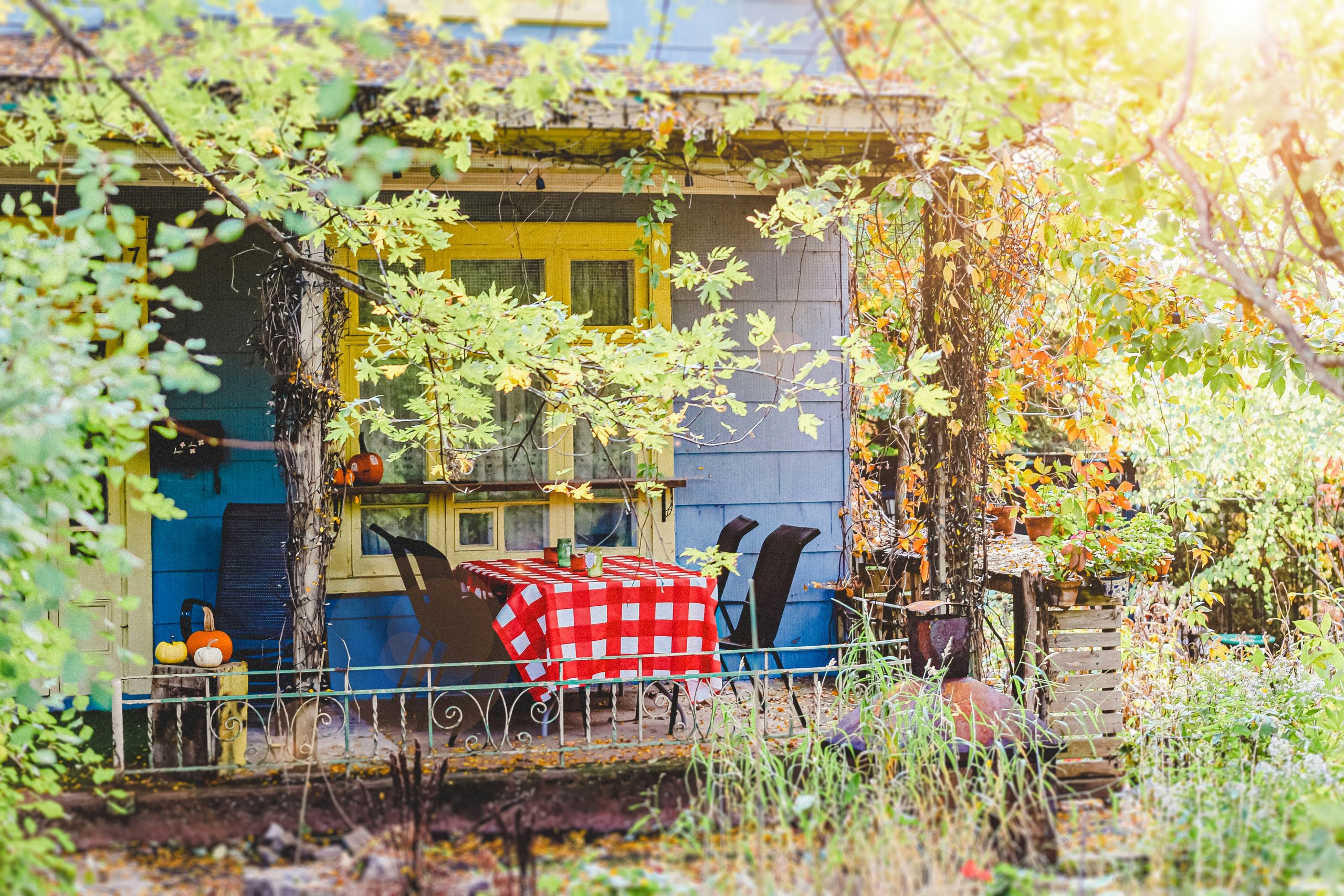 Cozy porch with table and chairs on a sunny day