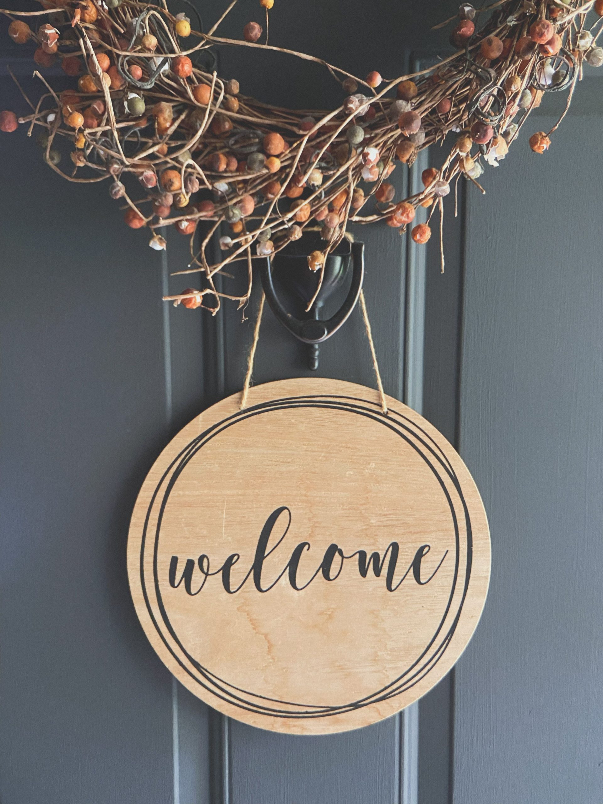 Cozy wooden welcome sign adorned with autumn-inspired wreath, perfect for home decor ideas.