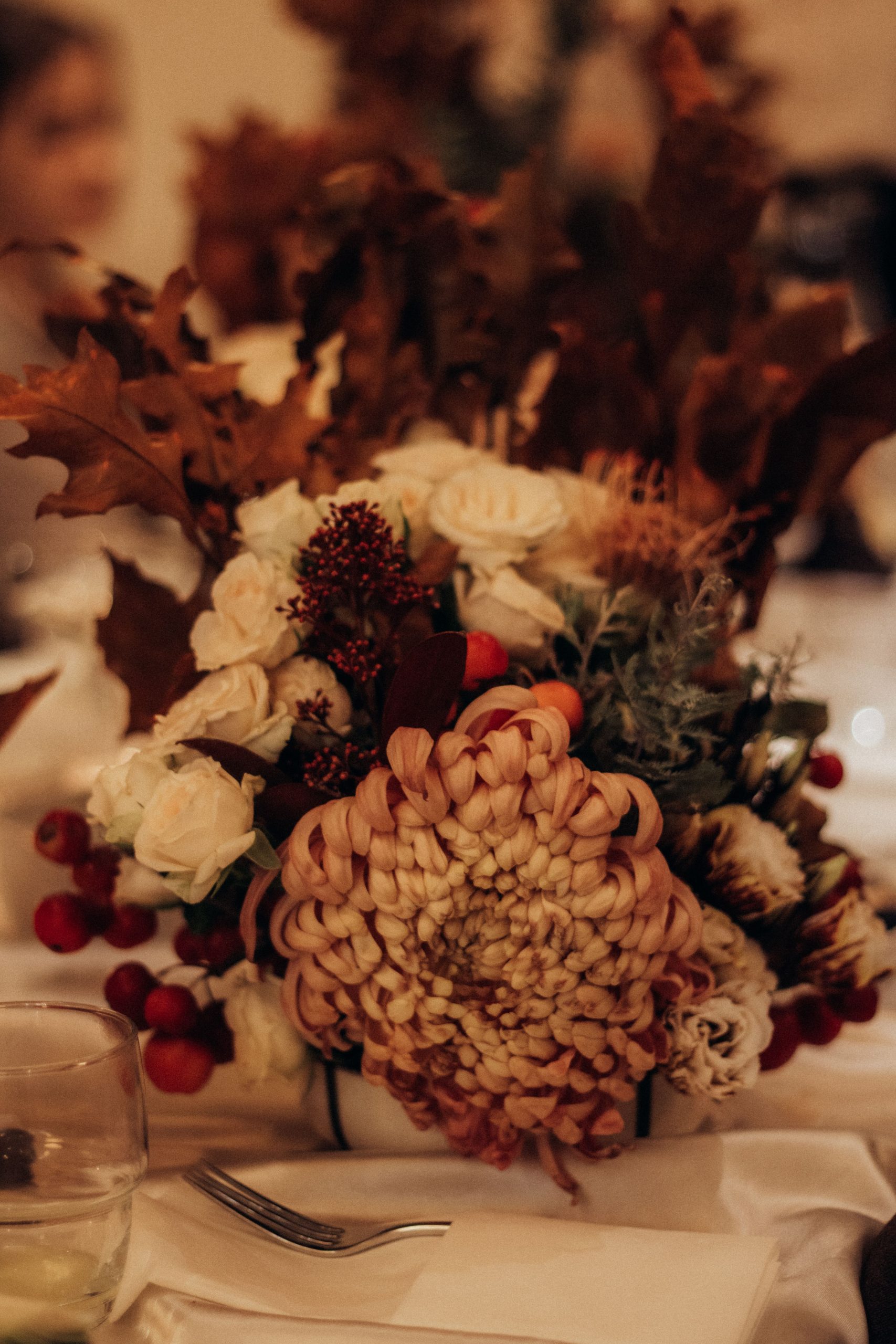 Elegant autumn-themed floral arrangement highlighting seasonal colors and textures.