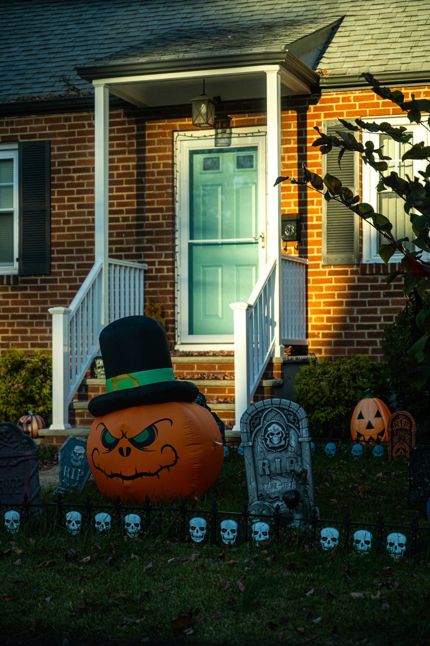 Halloween decorations in front of a brick house