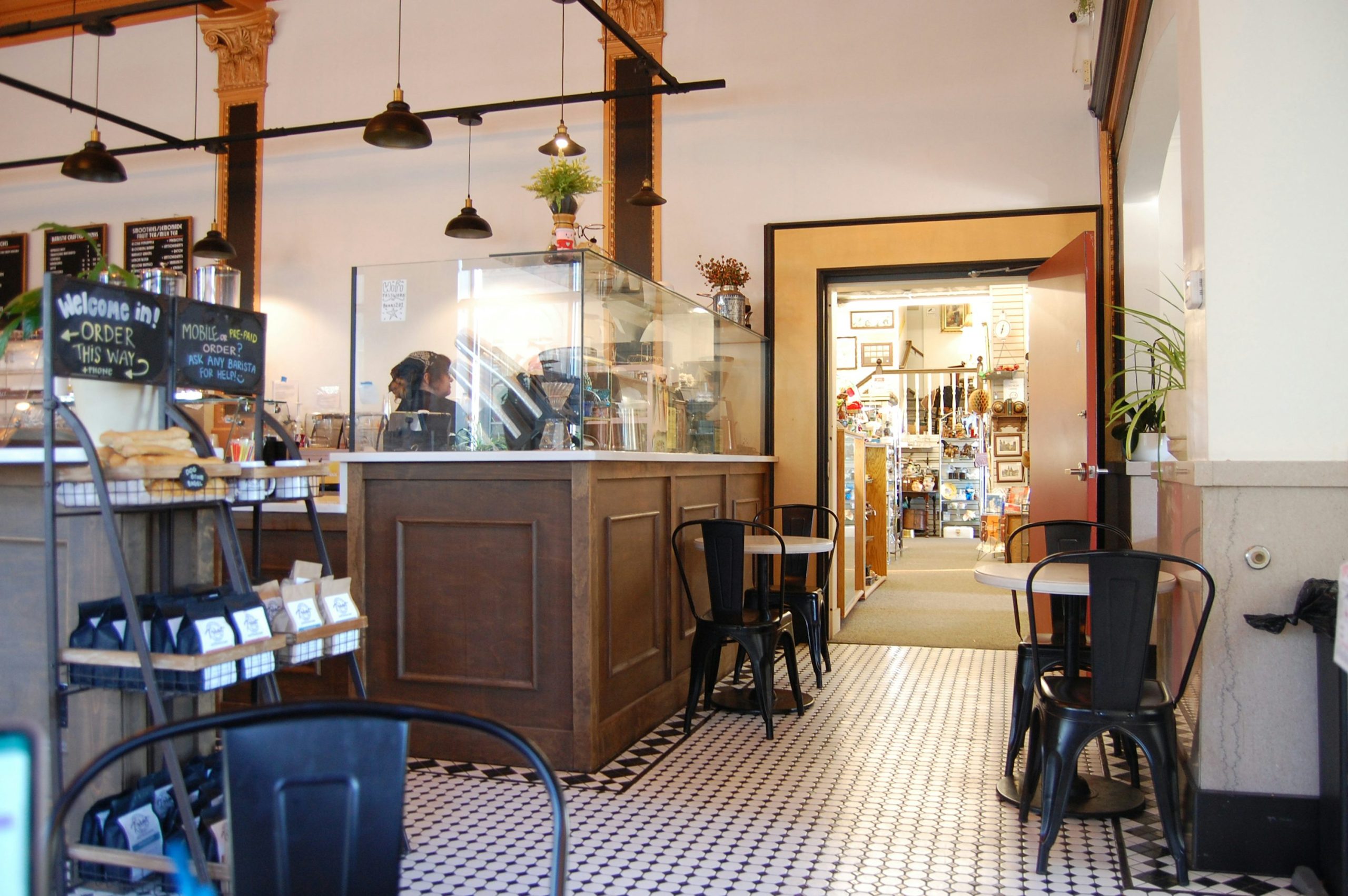 Interior of a cozy coffee shop with counter and tables. photo – Free Coffee beans Image on Unsplash