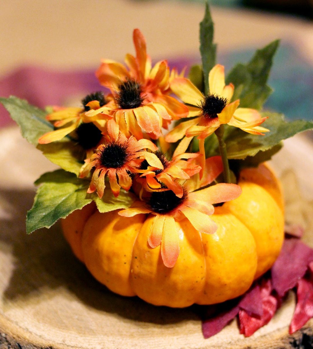 Make easy Thanksgiving table decorations or favors from miniature pumpkins as vases or votives to help you set a pretty table with the grandkids!