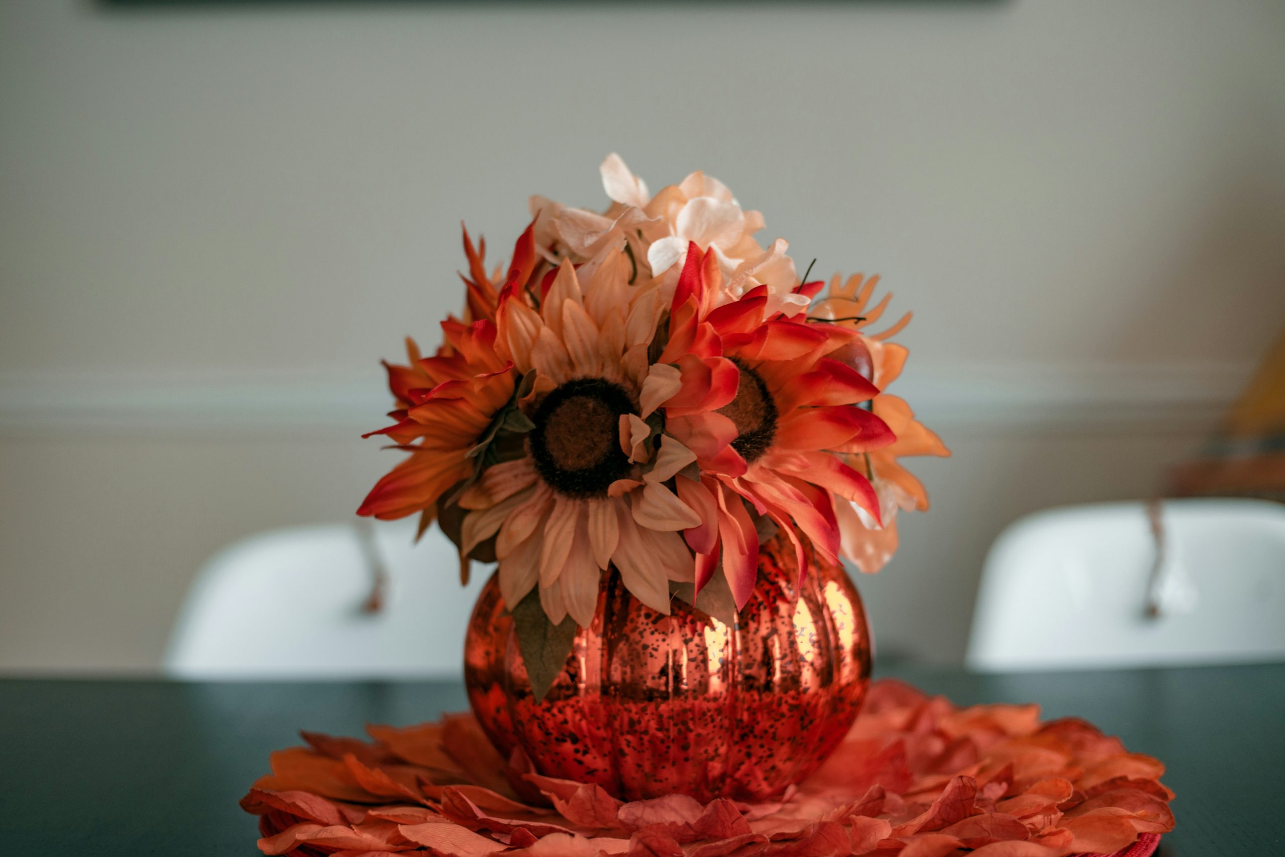 pink and white flower bouquet on red and white table