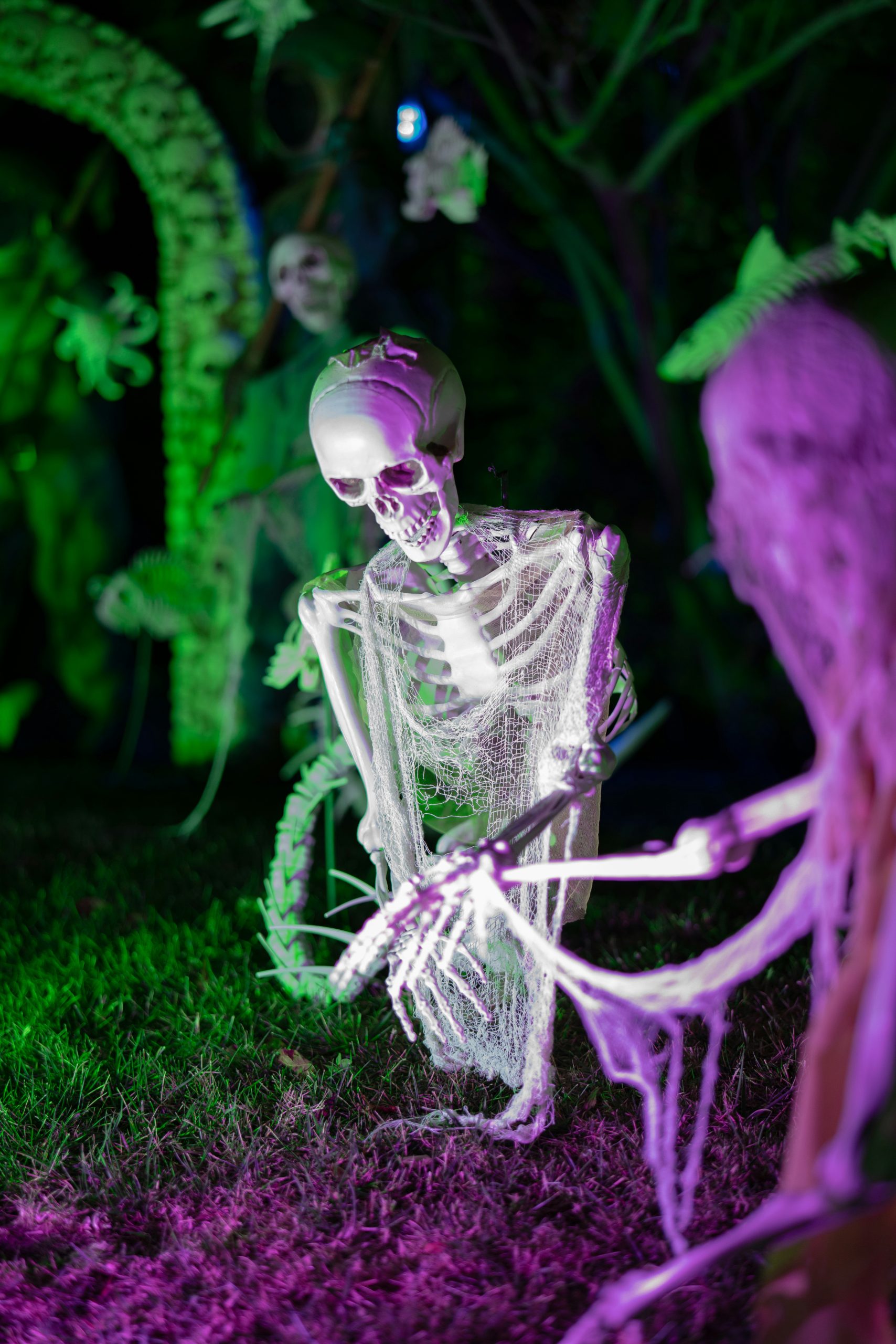 Spooky skeletons in a dark, eerie outdoor setting