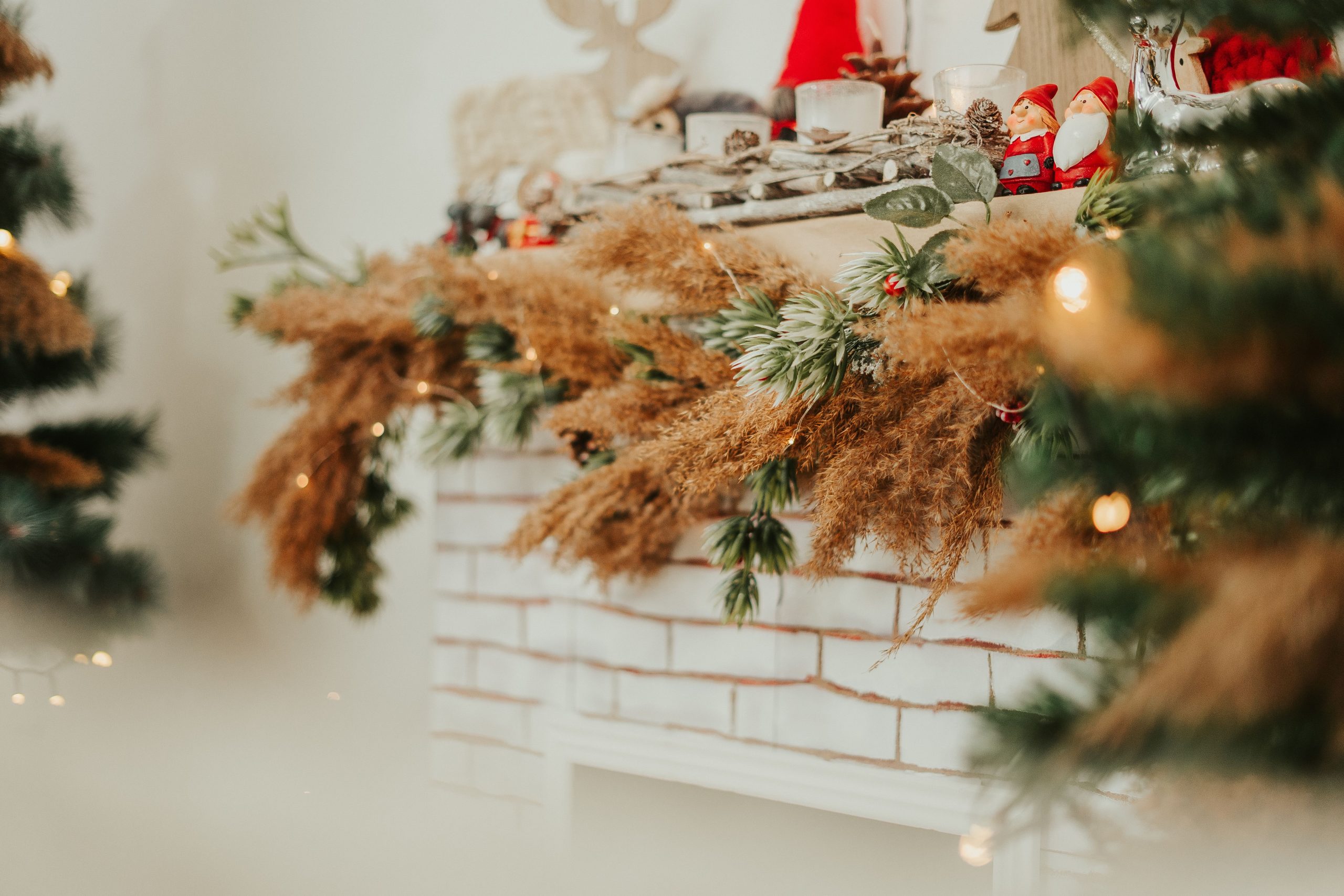 Warm and cozy Christmas fireplace adorned with natural and festive decorations creating a holiday ambiance.