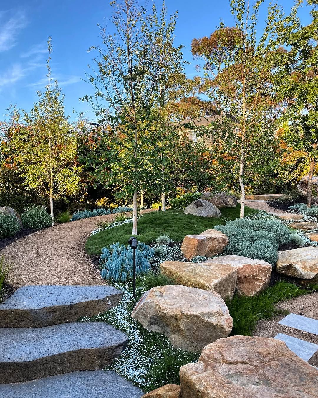 15 Backyard Design Ideas for 2026 Where Boulders Replace Flat Edges and Decorative Fill