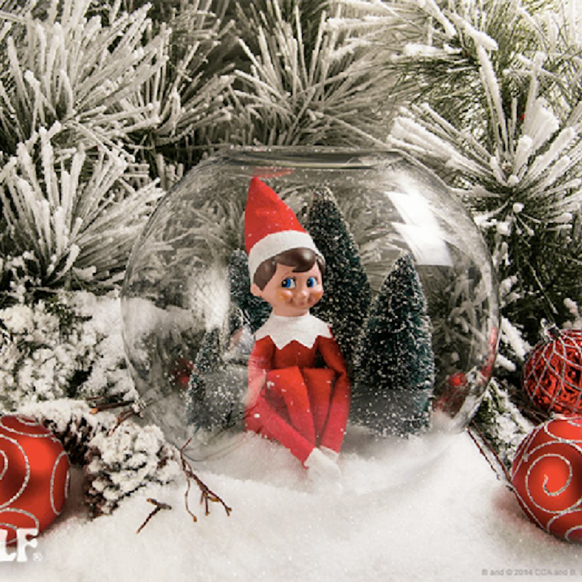 9 Elf On The Shelf Ideas Using Christmas Decorations, 'Cause They're Festive & Easy