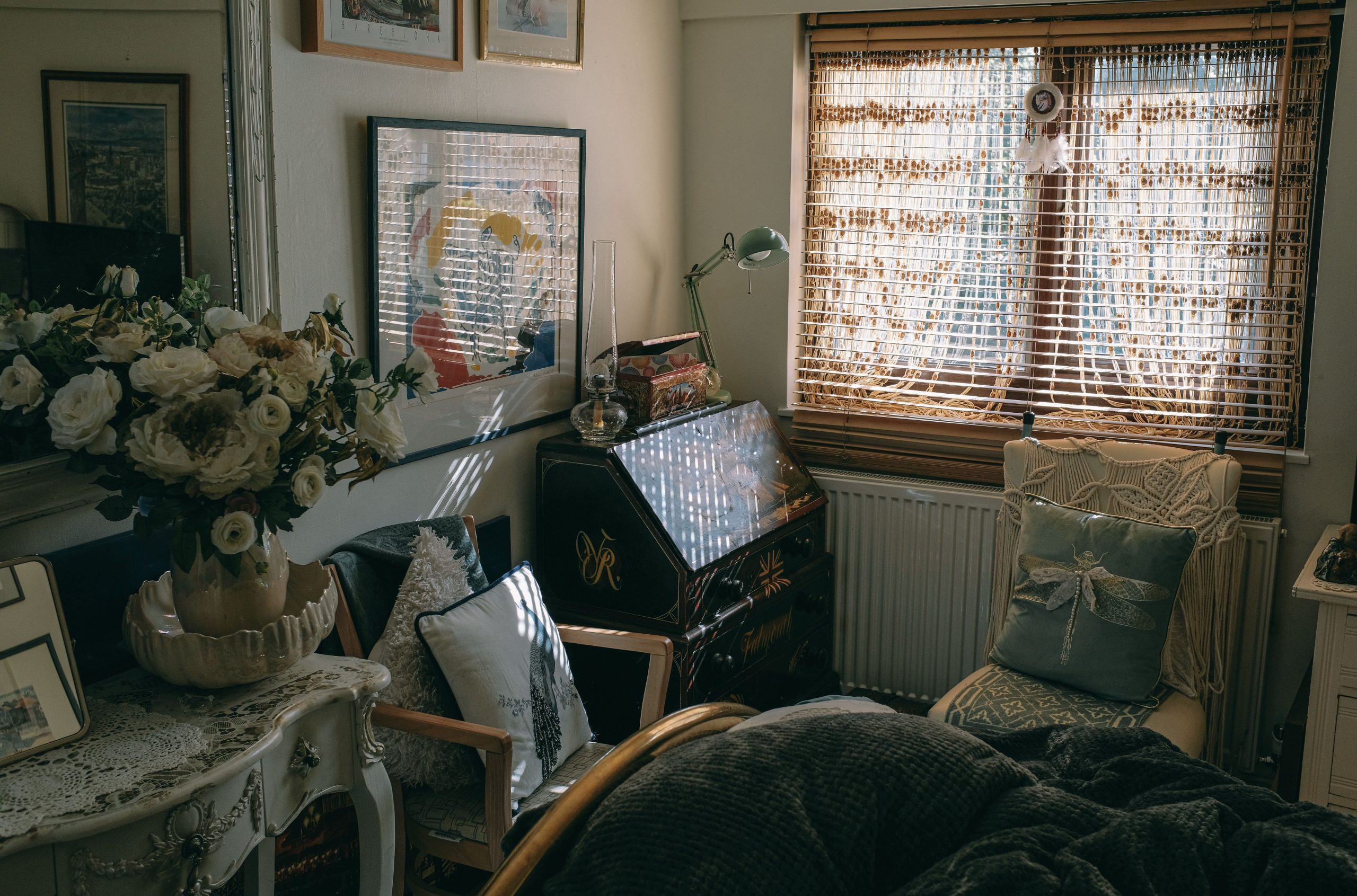 A beautifully arranged vintage interior with natural light, featuring classic furniture and elegant decoration.