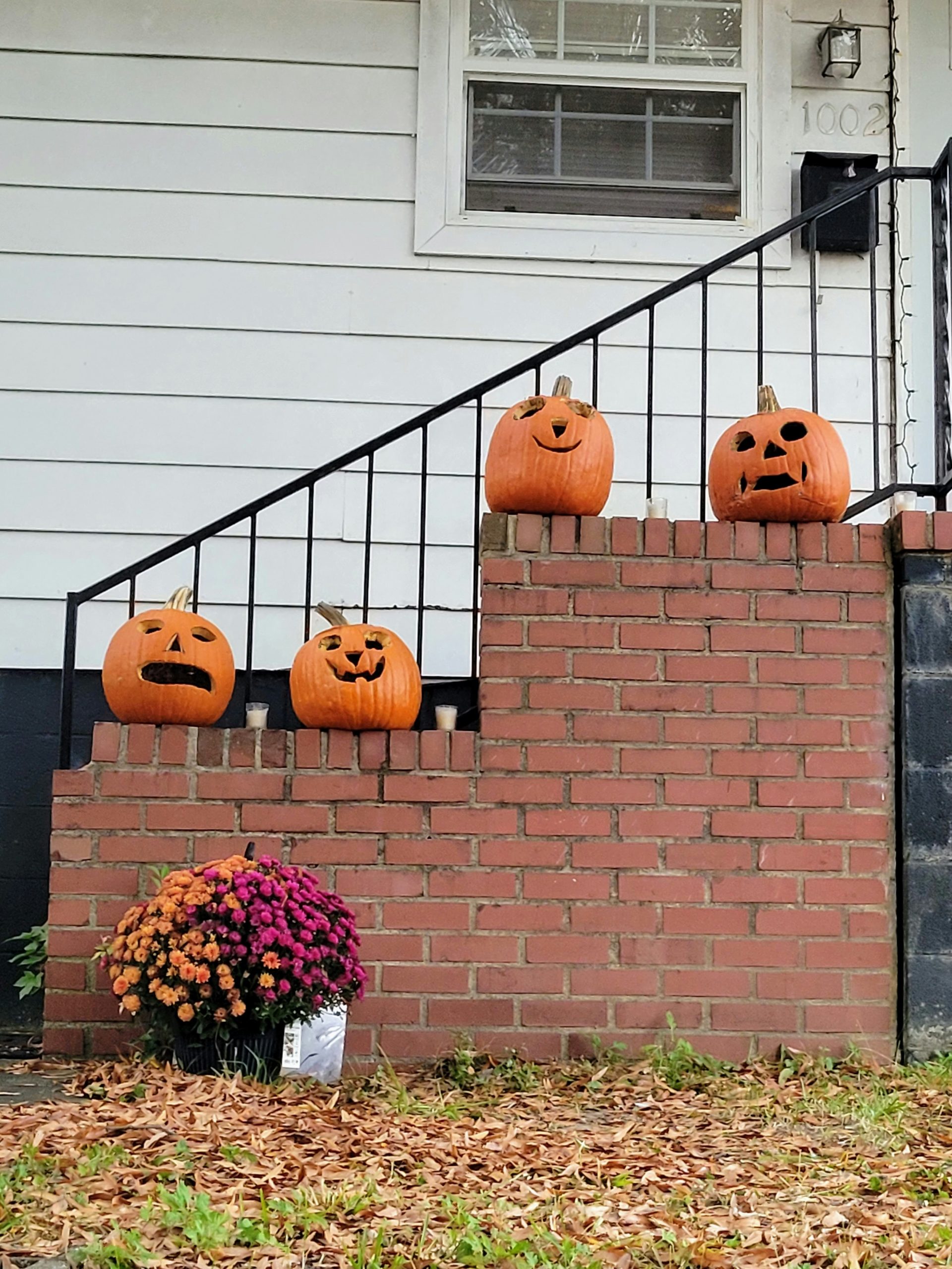 A set of stairs decorated with pumpkins and jack - o'- lanterns