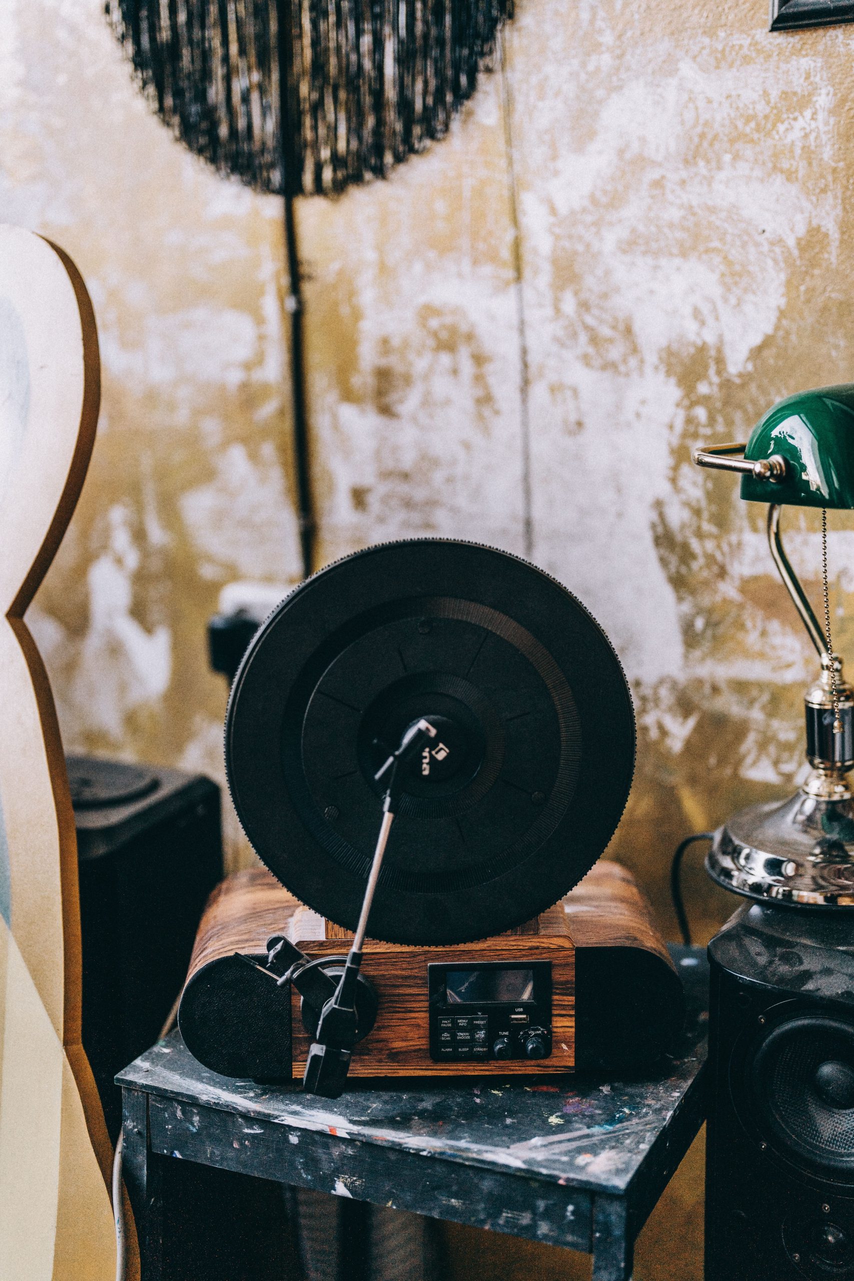 A vintage gramophone with a rustic backdrop indoors, exuding nostalgia and charm.