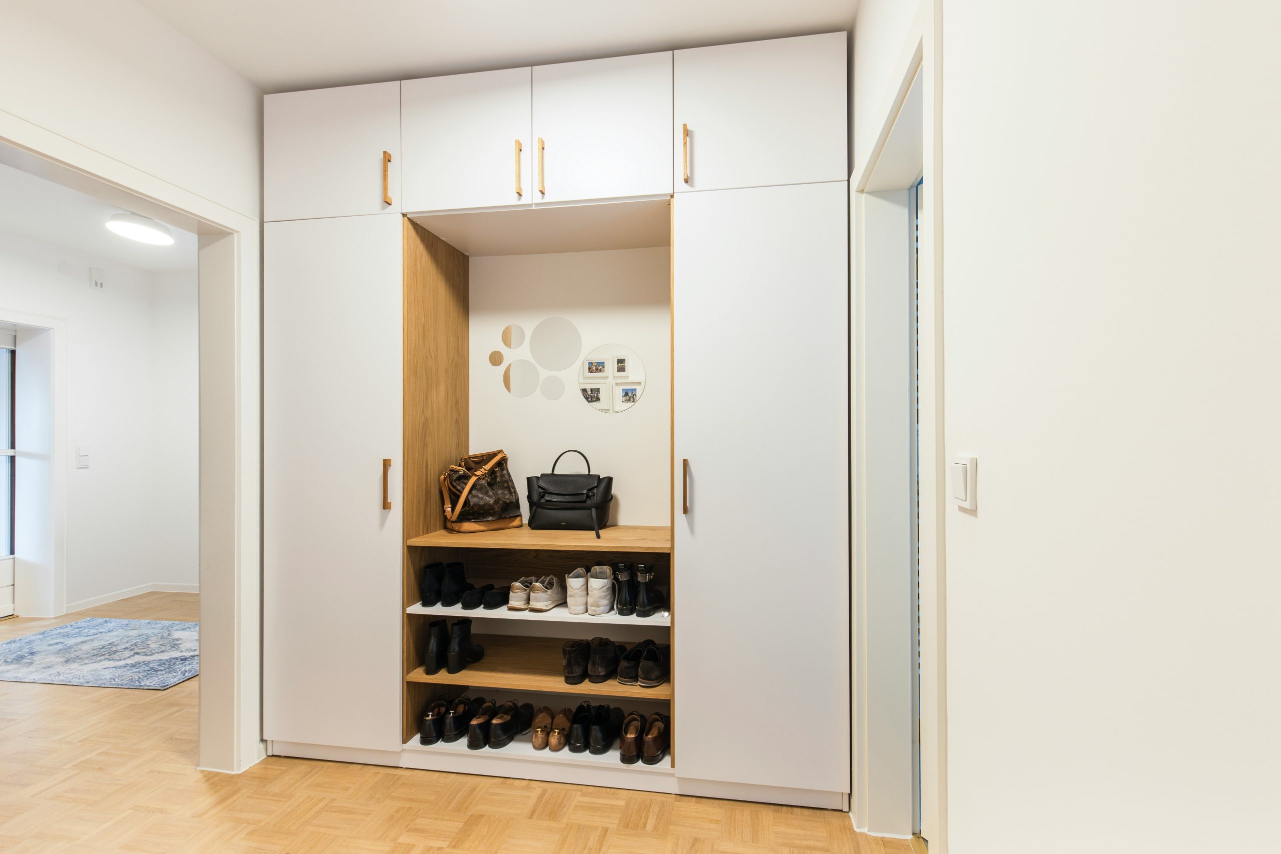 Big fitted hallway storage. Combination of MDF and solid wood.