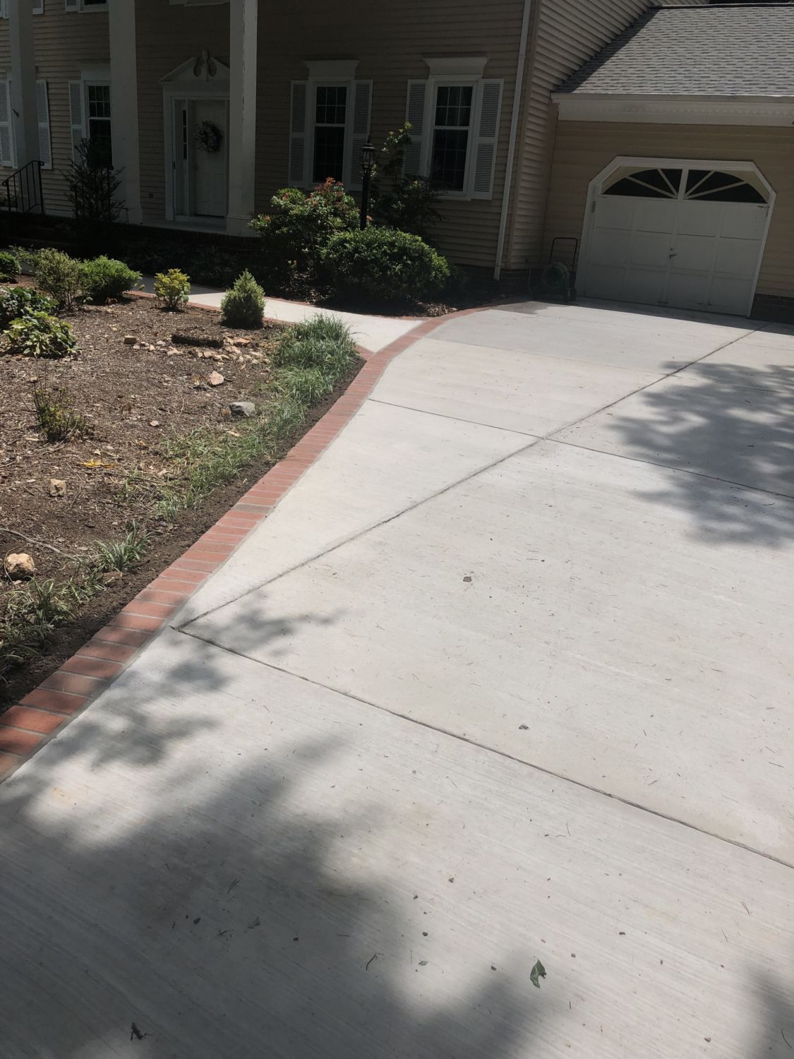 Concrete Driveway and Sidewalk with Brick Borders in Alexandria, Virginia - Wright's Concrete