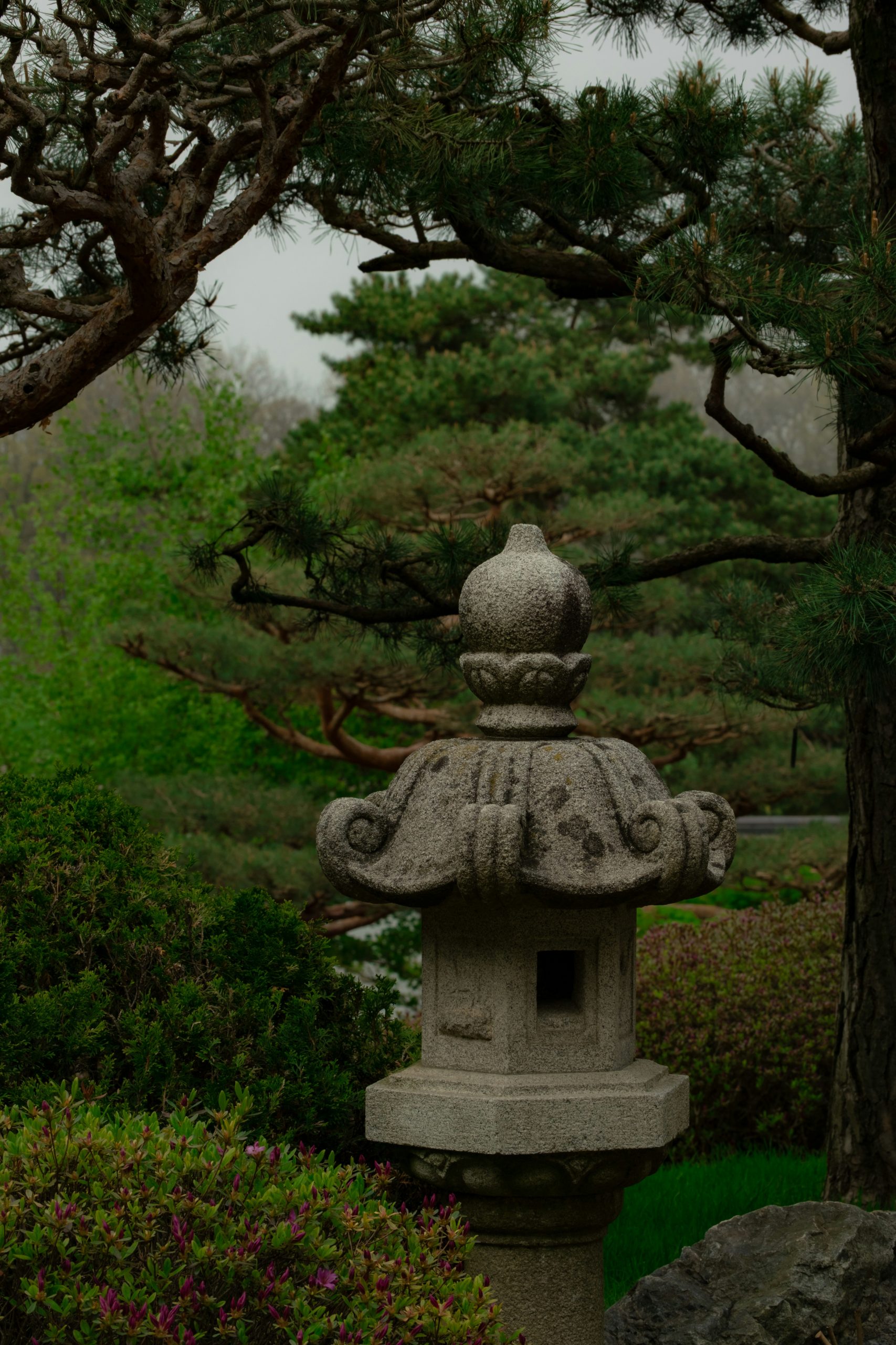 Ornate stone lantern in a peaceful green garden