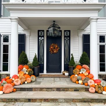 pumpkin decorating service in New Jersey & New York, luxury fall porch decor piled pumpkins