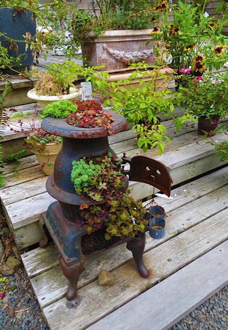 Recycling Old Stoves for Metal Planters to Save Money on Outdoor Decorations