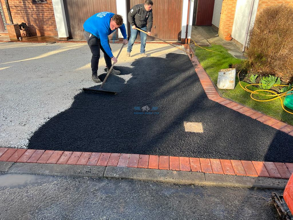Tarmac Driveway with Red Brick Edging in Lixwm, Flintshire - Rhino Pave LTD