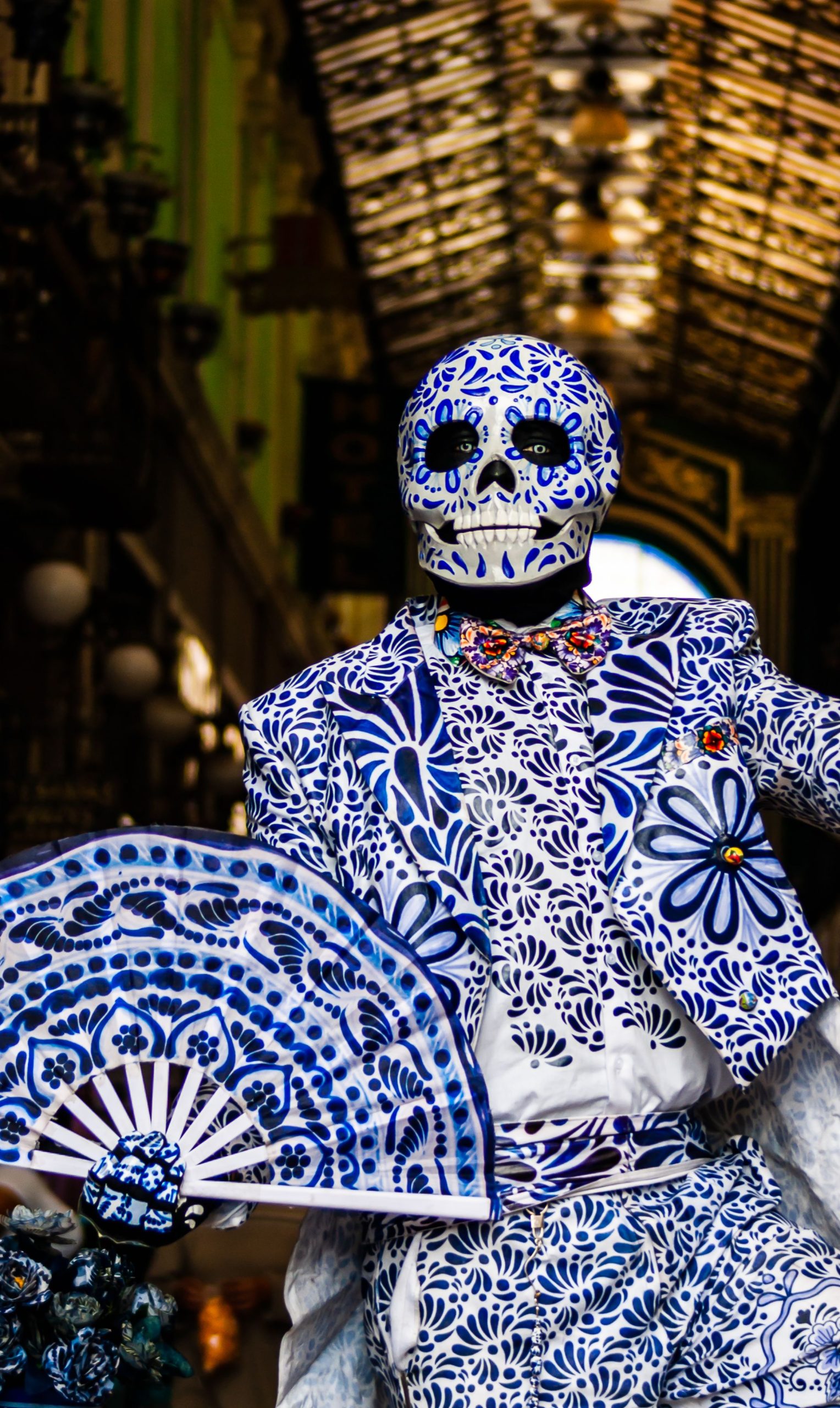 Vibrant Day of the Dead costume with floral patterns, Puebla, Mexico