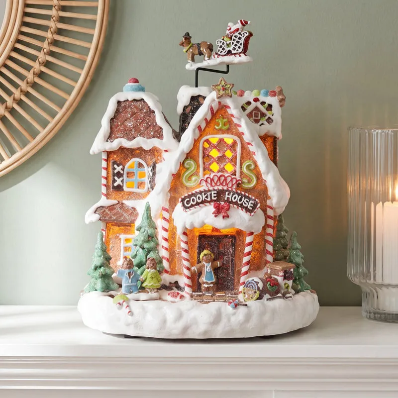11' Animated Gingerbread Cookie House By Moments in Time | Michaels
