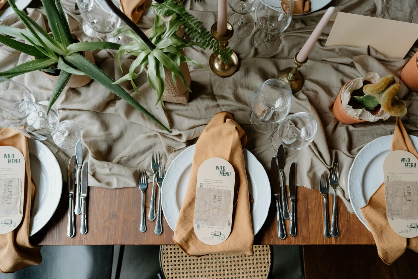 A beautifully set dining table with place settings and decor