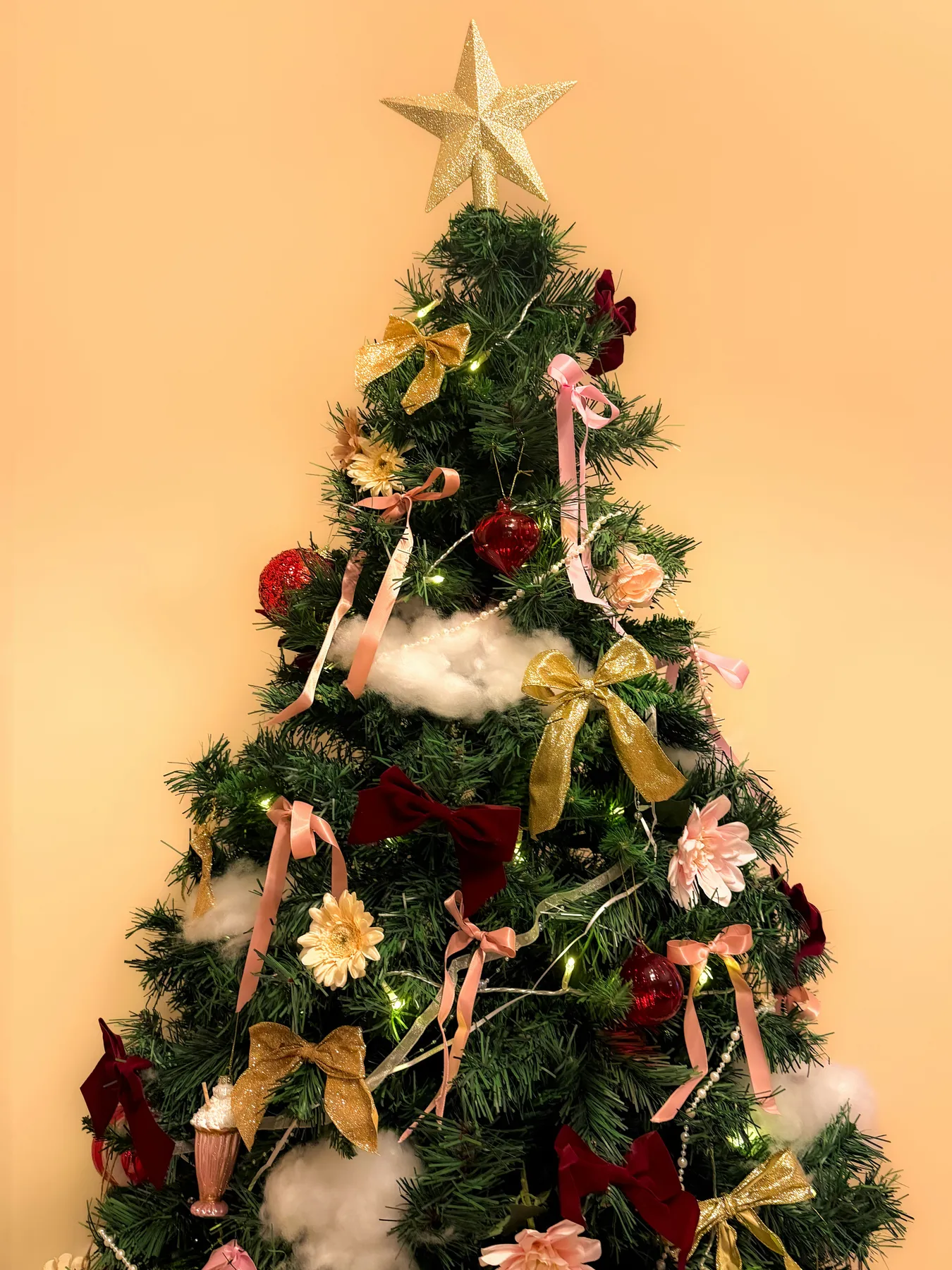 A decorated christmas tree with bows and lights