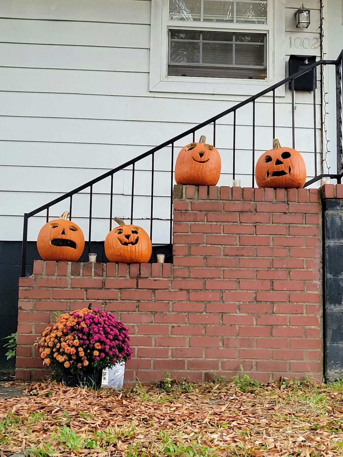 A set of stairs decorated with pumpkins and jack - o'- lanterns