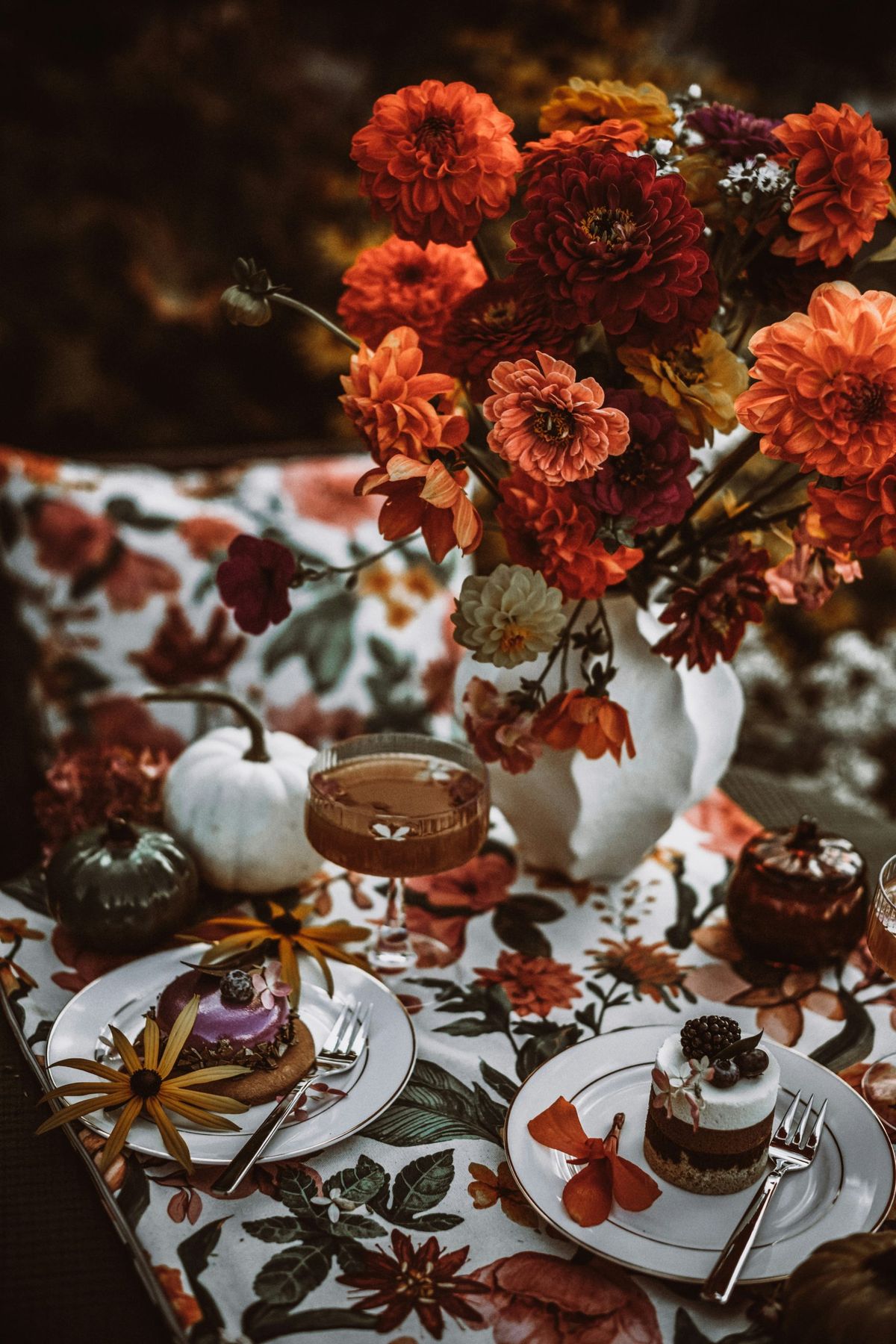 Autumnal table setting with desserts and flowers